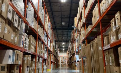 Warehouse aisle with boxes stacked on pallet racks