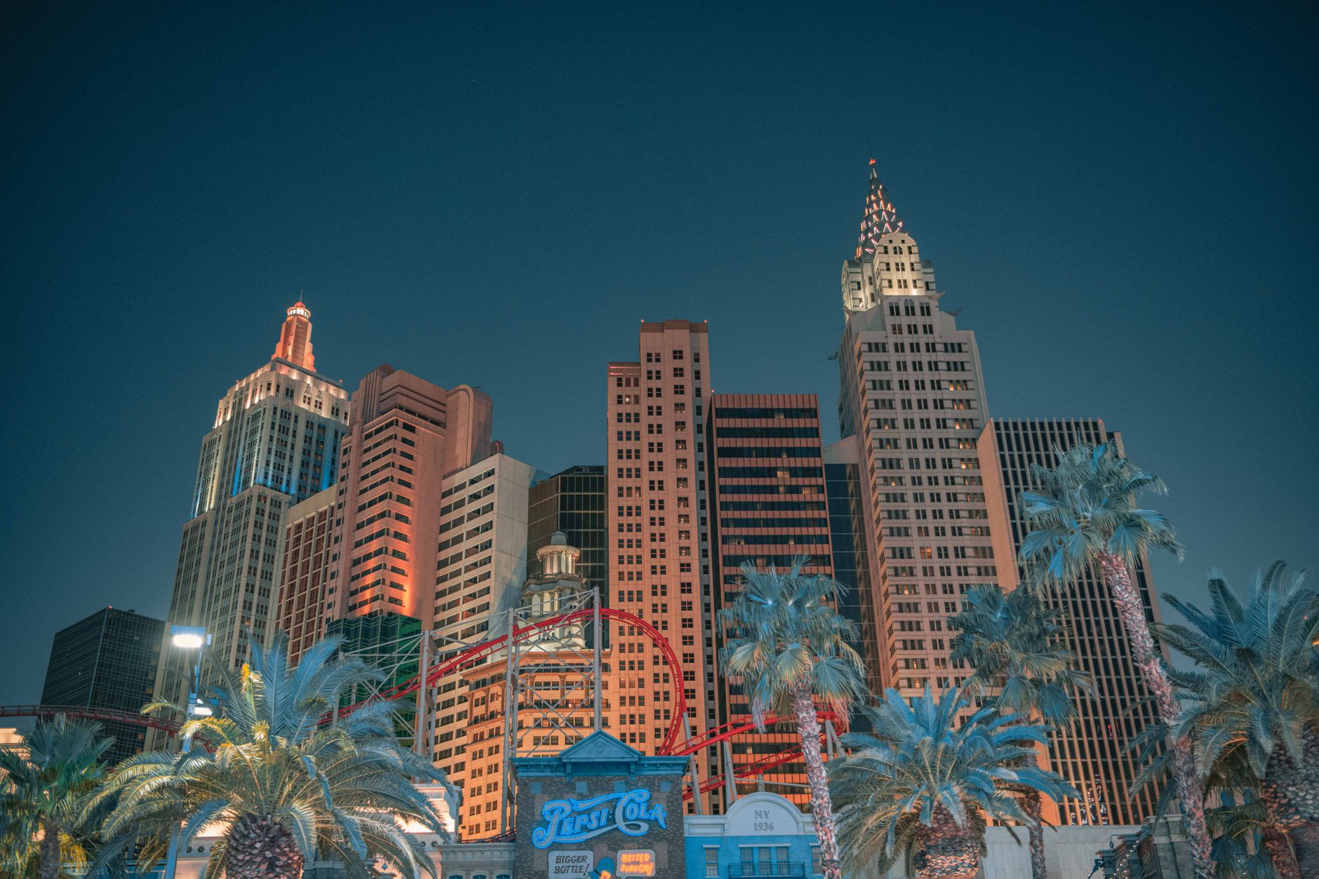 Night view of the Las Vegas skyline featuring iconic skyscrapers and an illuminated roller coaster. Related image for Hospitality in the USA: Why Independent Hotels Are Investing Now.