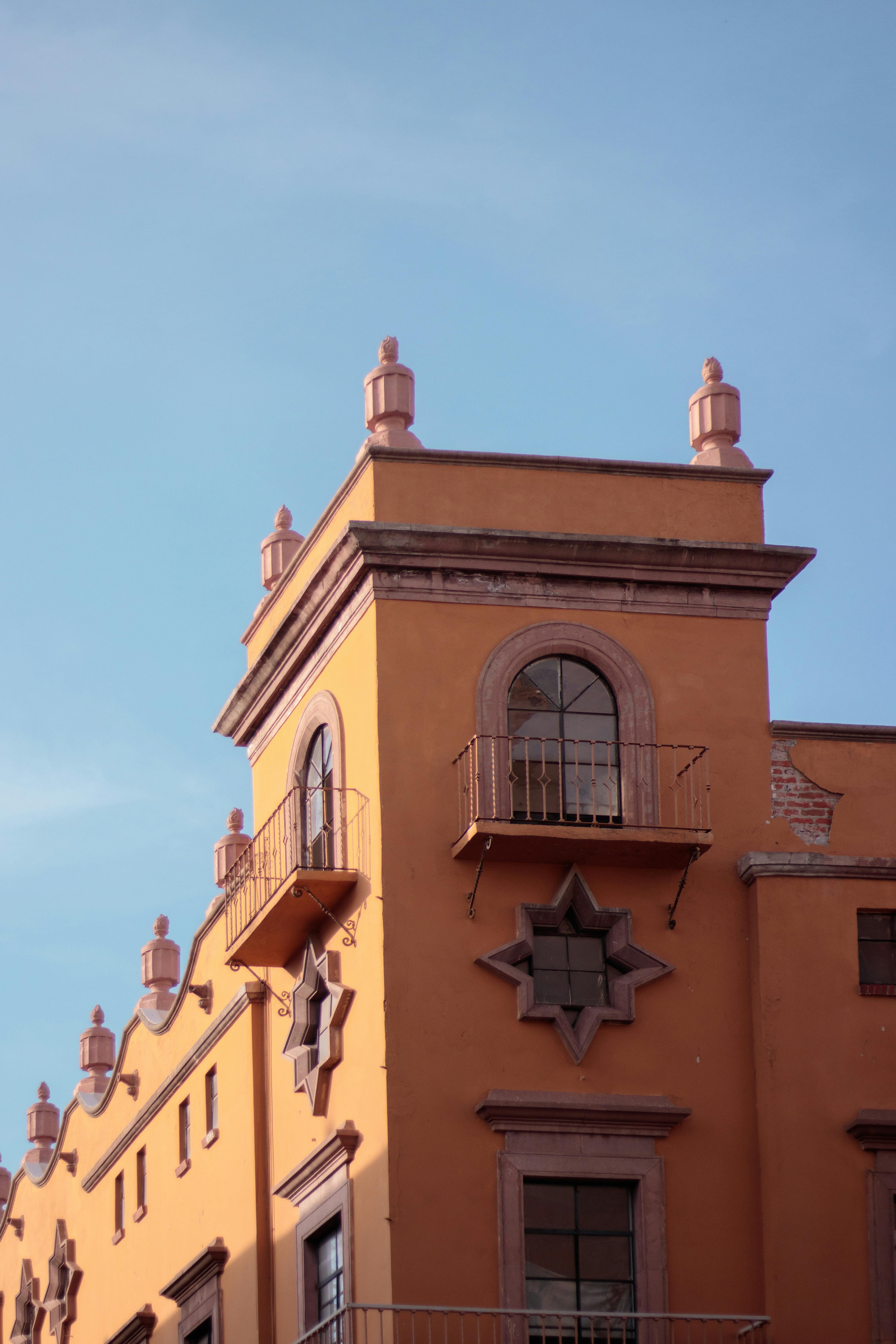 Architectural detail of a Mexican colonial building against a blue sky