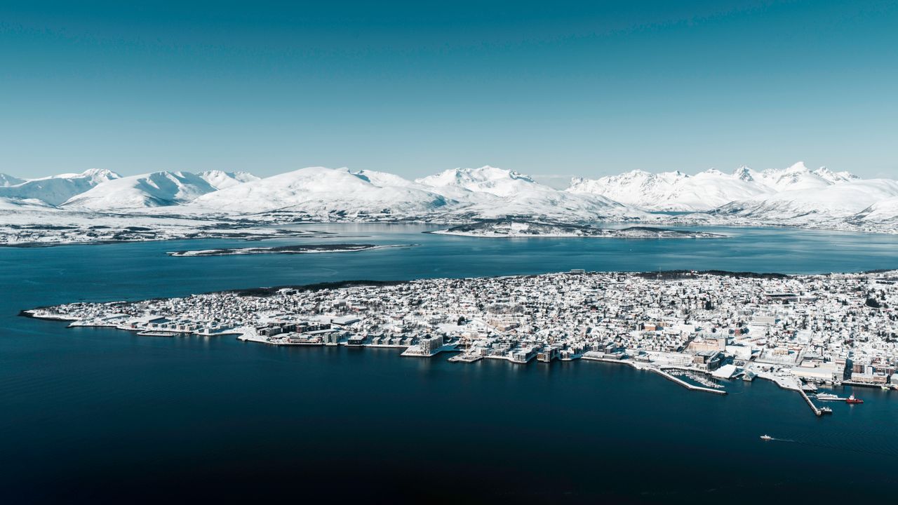 stunning aerial photograph of troms norway blanketed in snow with maje