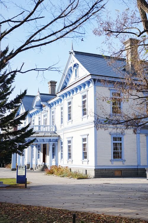 Free Charming blue Victorian house captured in a bright autumn landscape with trees. Stock Photo