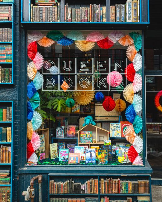 Vibrant display of books at Queen Books bookstore in Toronto, Ontario, Canada.