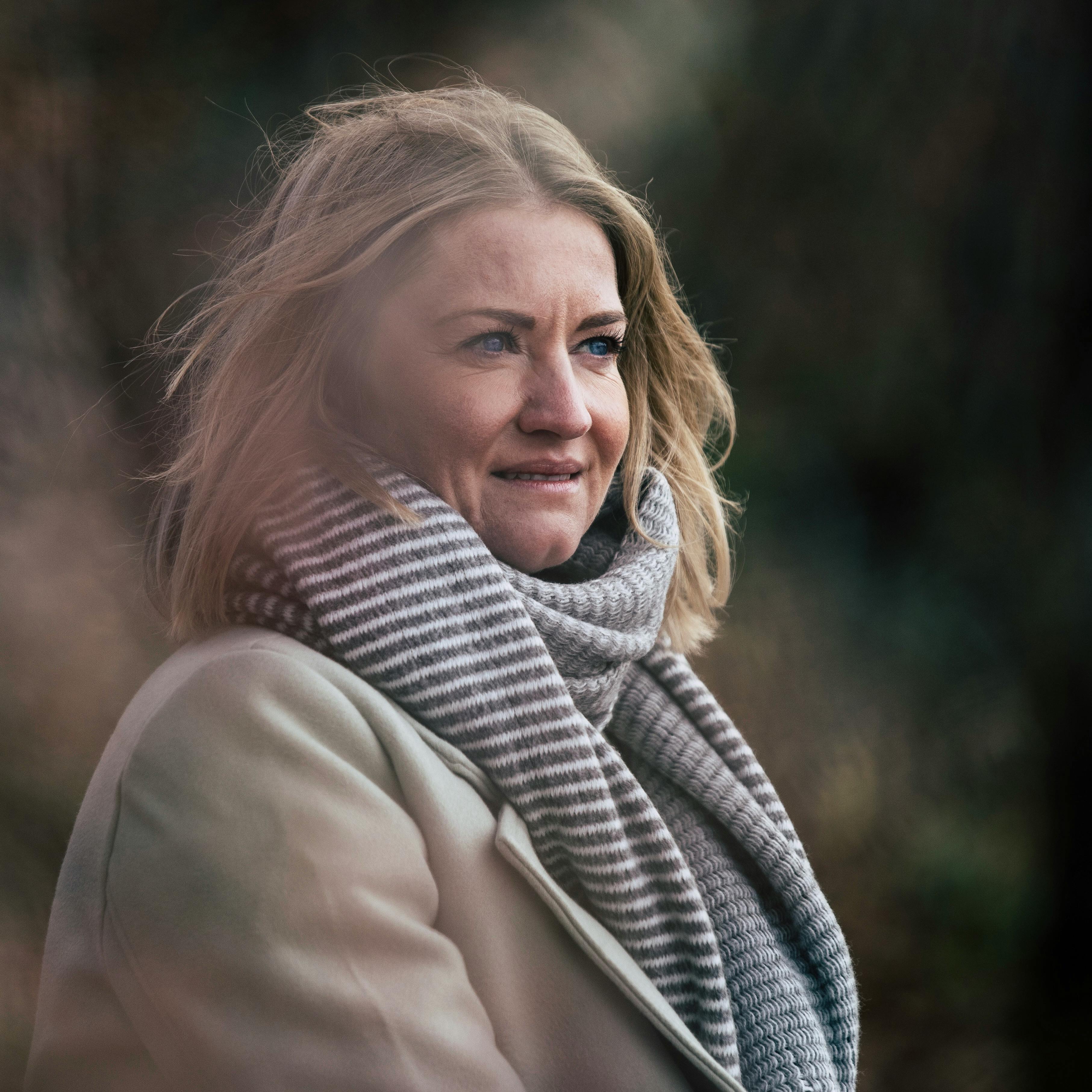 Captivating portrait of a woman outdoors in fall, Weßling, Germany.