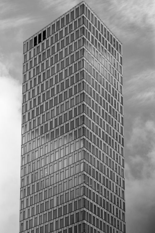 Free Black and white photo of a modern skyscraper in Gothenburg, Sweden. Captured in a minimalist style. Stock Photo