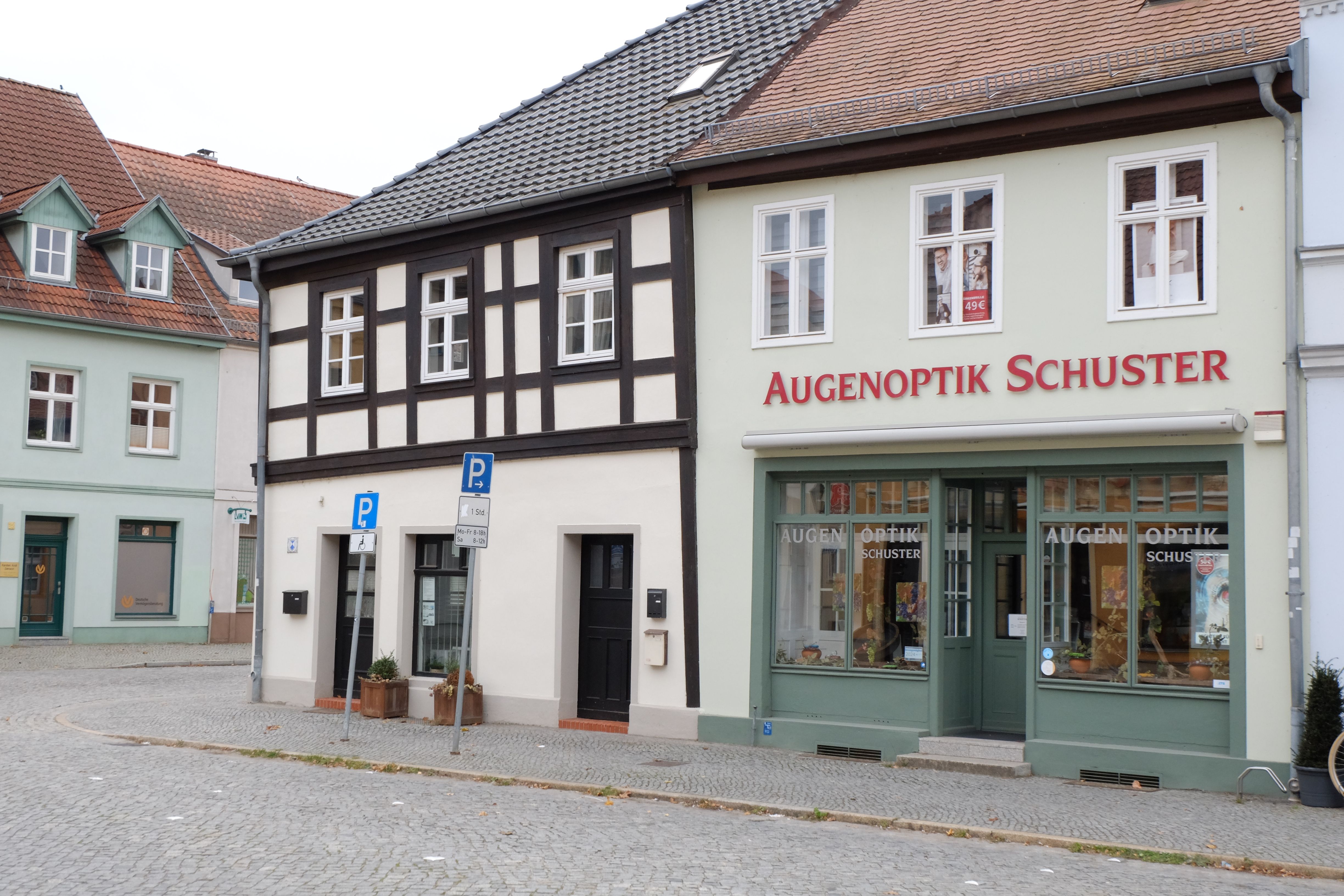 Charming Optician Storefront in Quaint European Town · Free Stock Photo