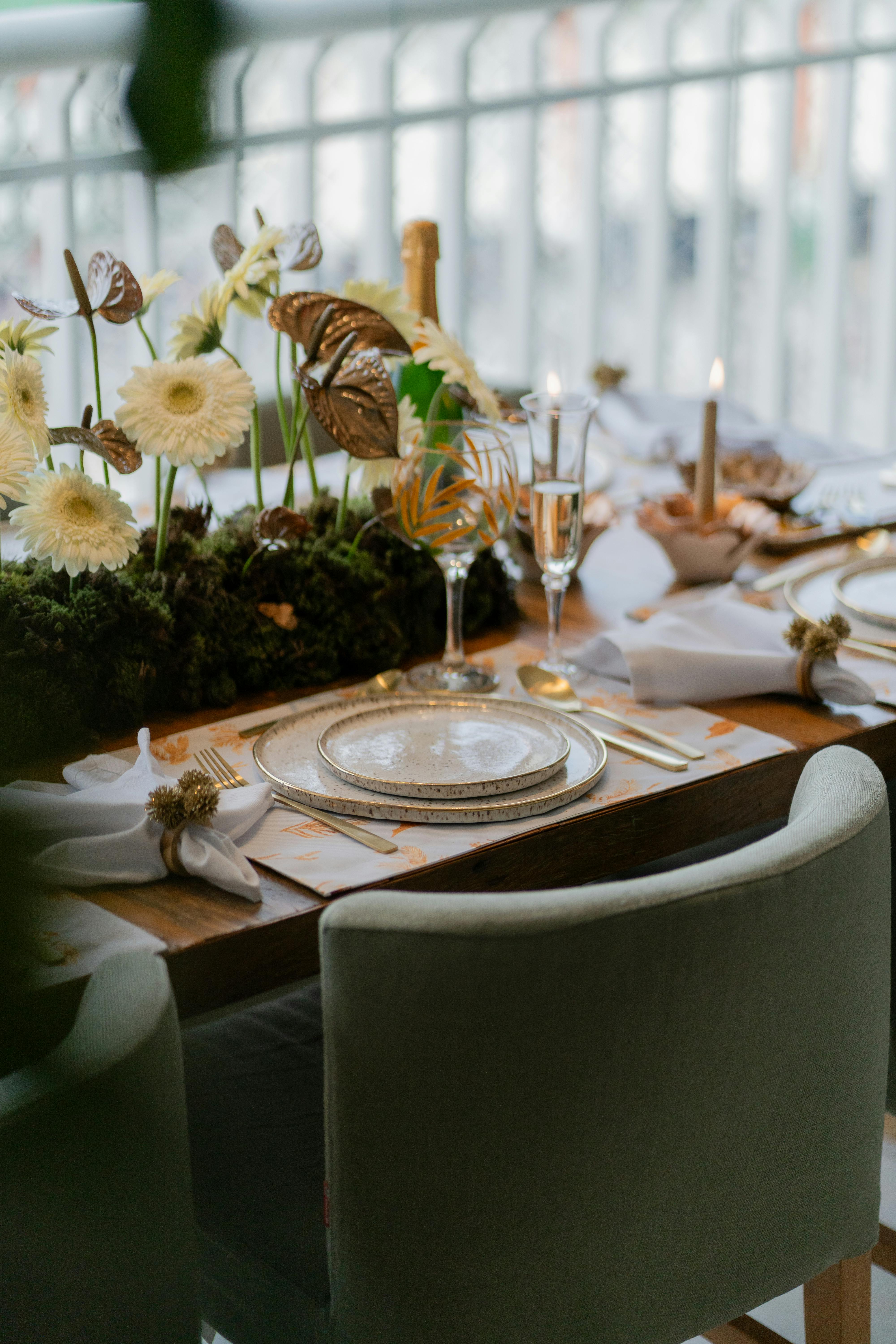 Elegant Dinner Table Setup with Floral Centerpiece · Free Stock Photo