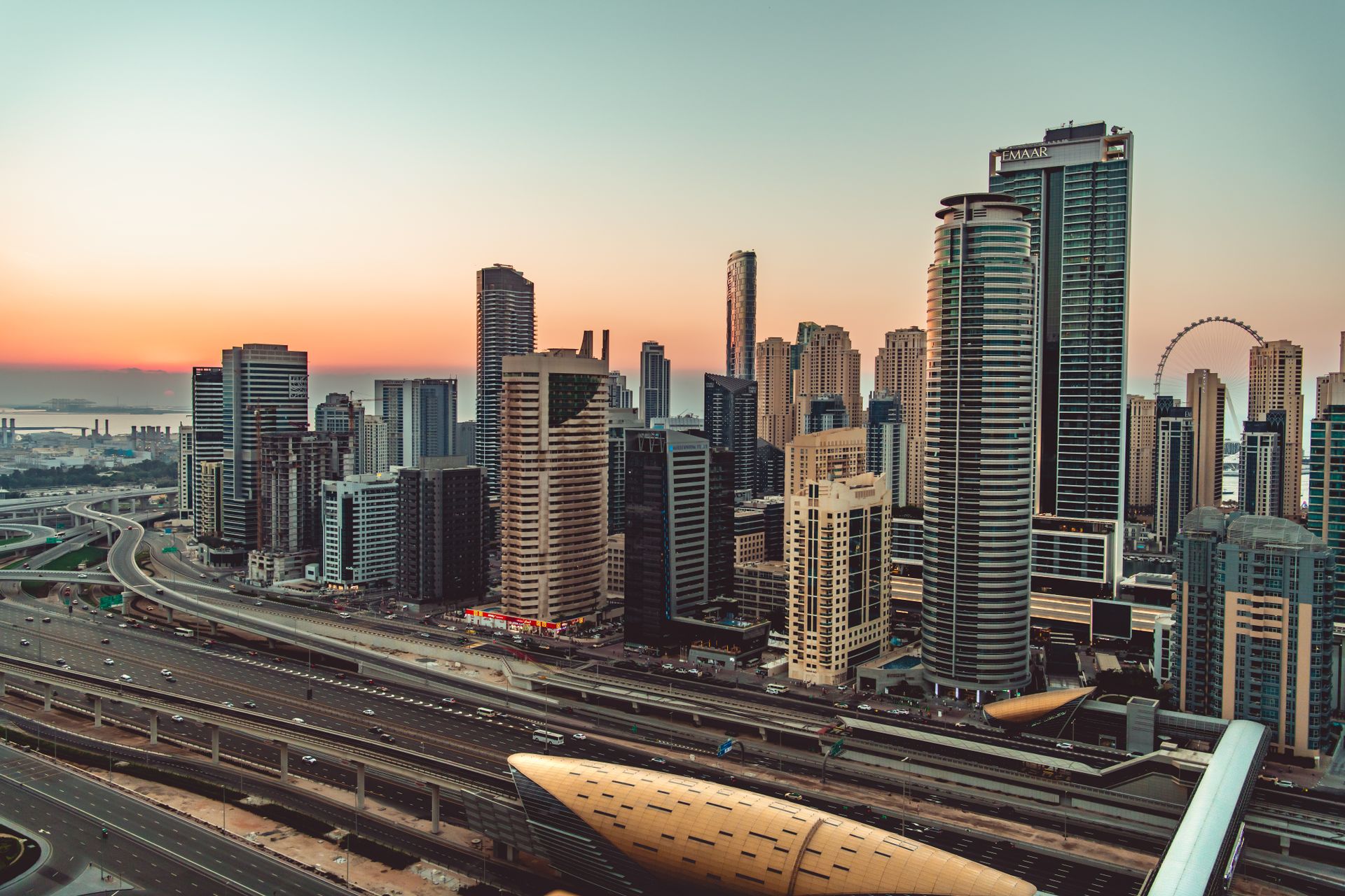 Breathtaking view of the Dubai Marina skyline at sunset, showcasing modern skyscrapers and vibrant u
