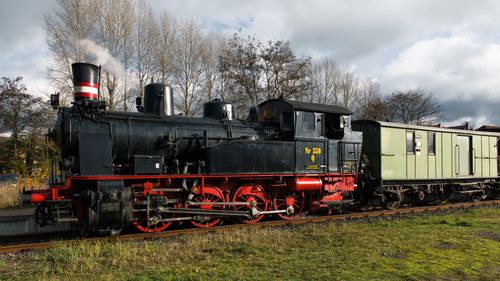 Free Vintage steam train locomotive at Geesthacht station in a nostalgic setting. Stock Photo