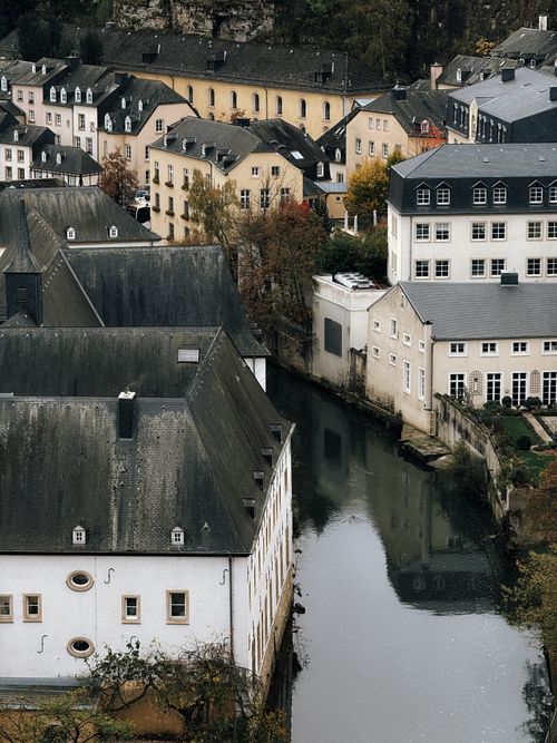 Free Aerial view of historic buildings by the canal in Luxembourg City, showcasing old-world charm. Stock Photo