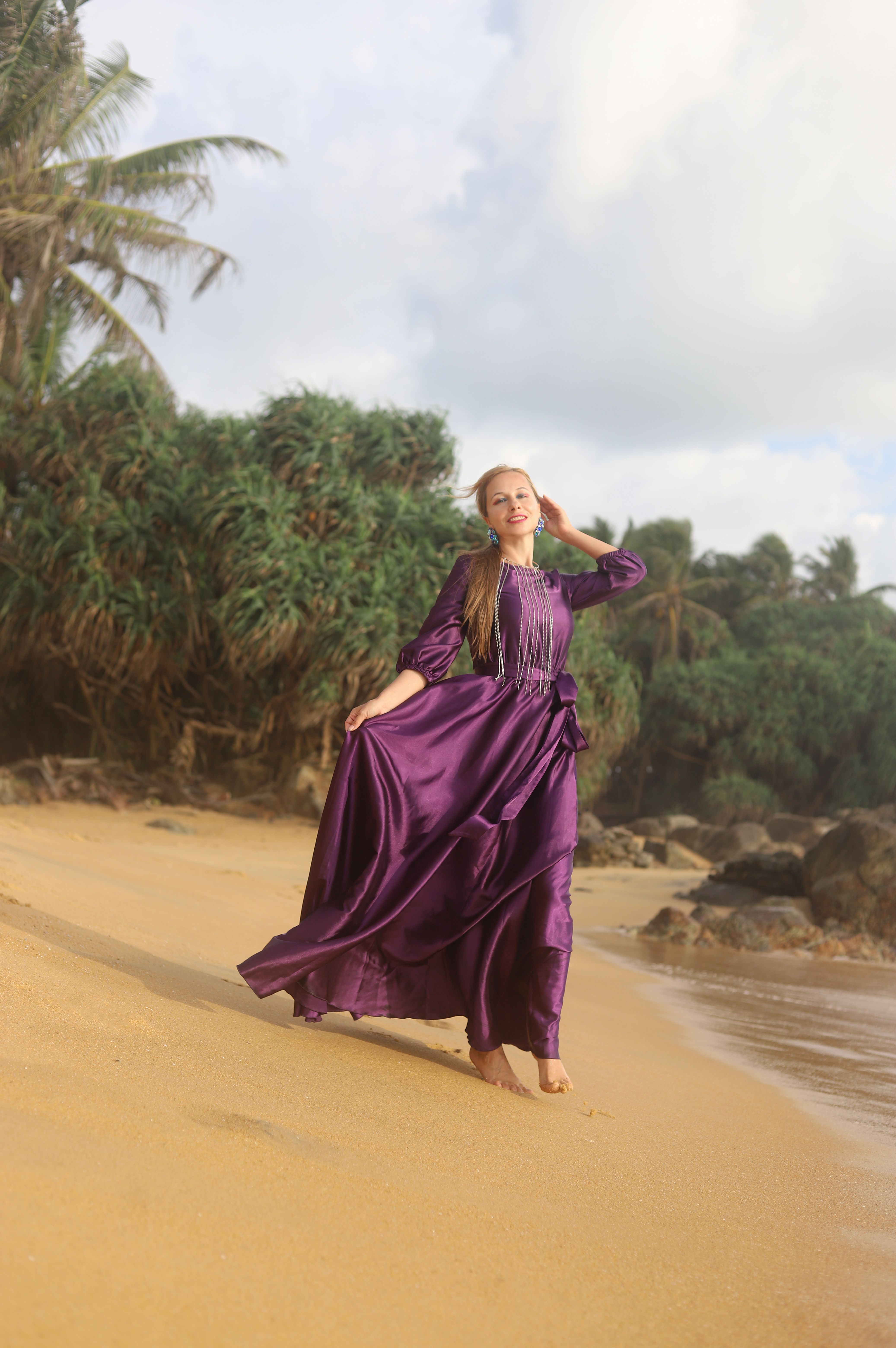 Elegant Woman in Purple Dress on Tropical Beach  Free Stock Photo