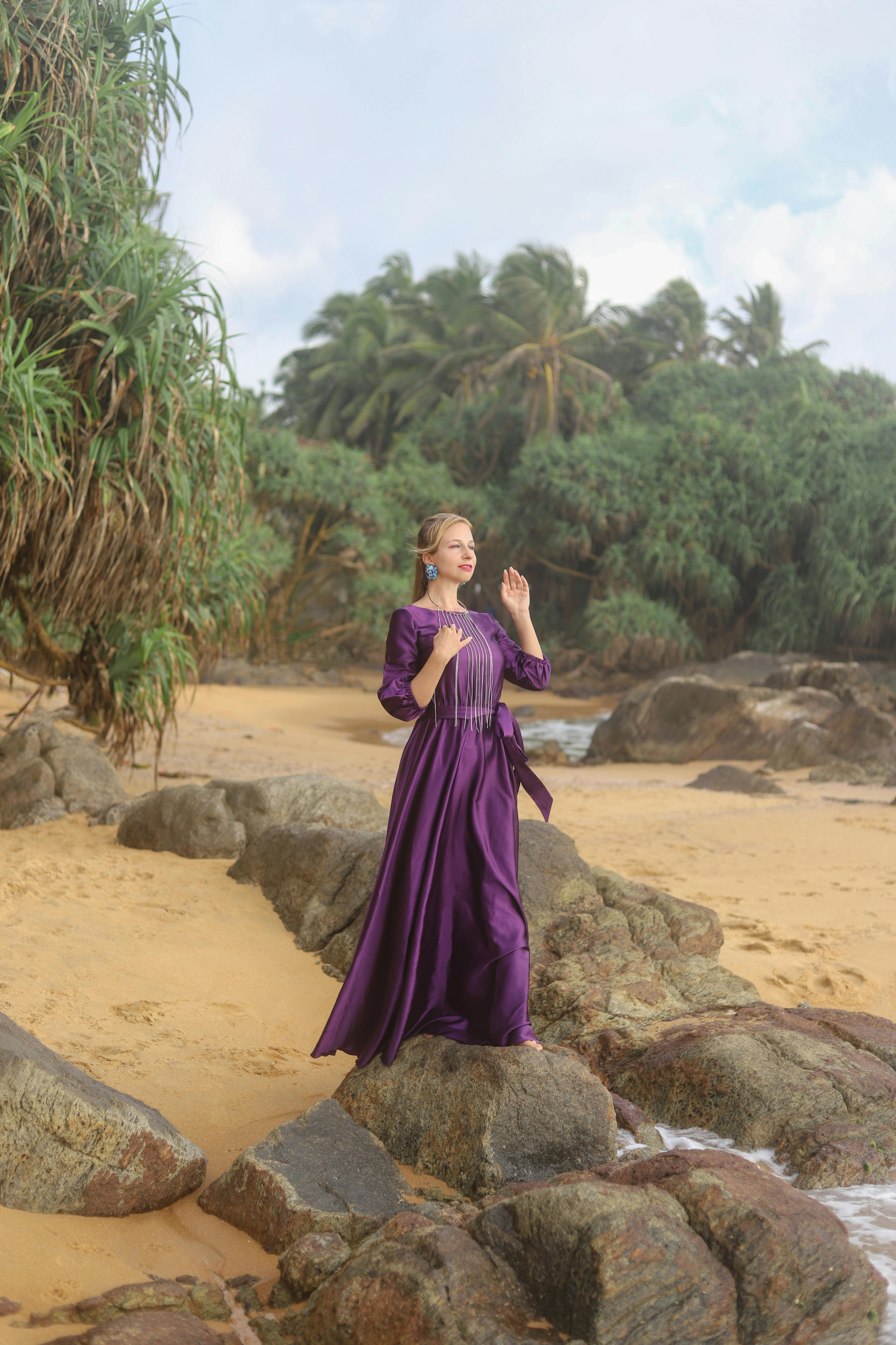 Elegant Woman in Purple Dress on Tropical Beach  Free Stock Photo