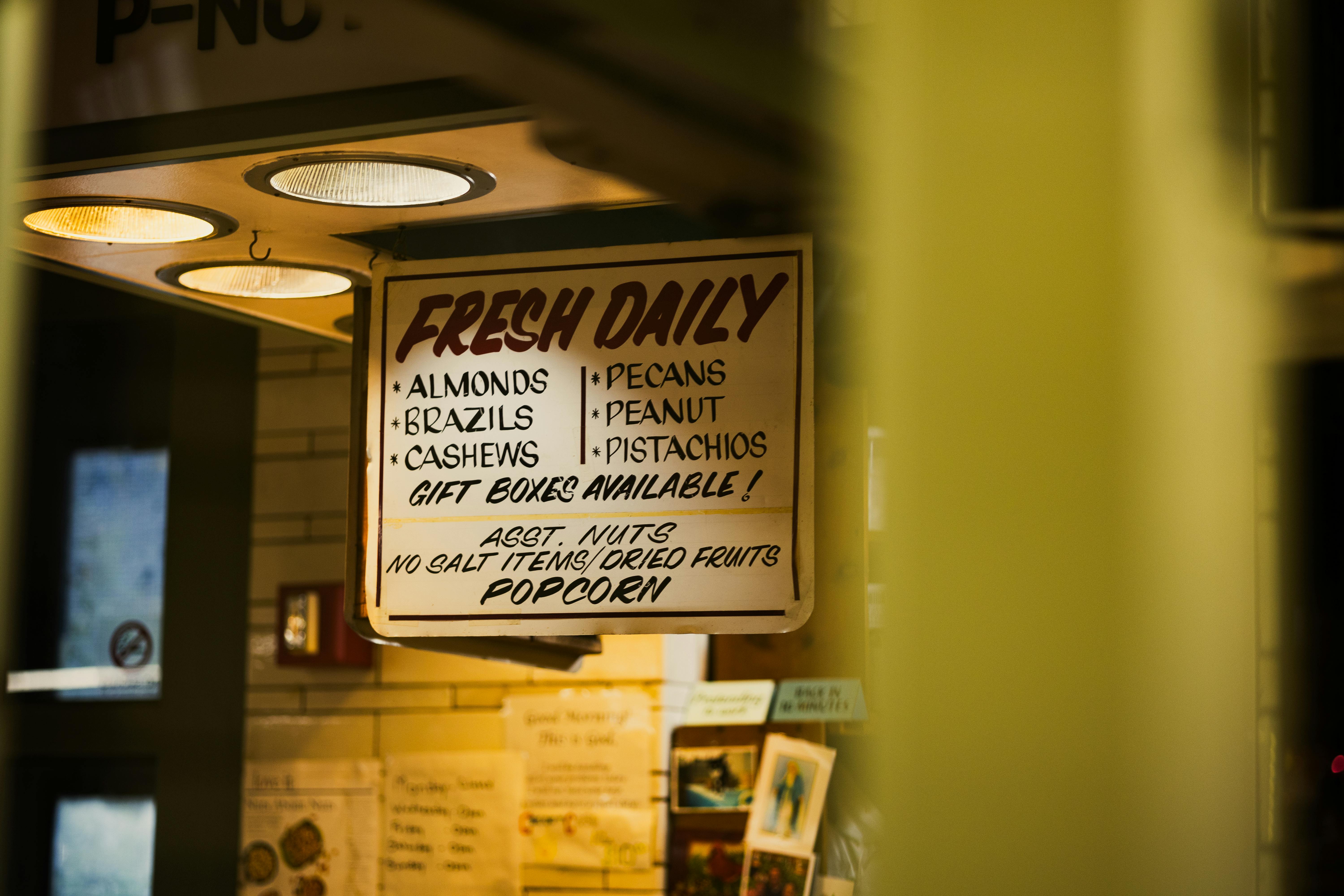 https://www.pexels.com/photo/indoor-nut-and-dried-fruit-display-sign-29462793/