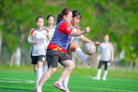 Women players compete fiercely in a soccer match in Hà Nội, capturing the spirit of teamwork and sports.