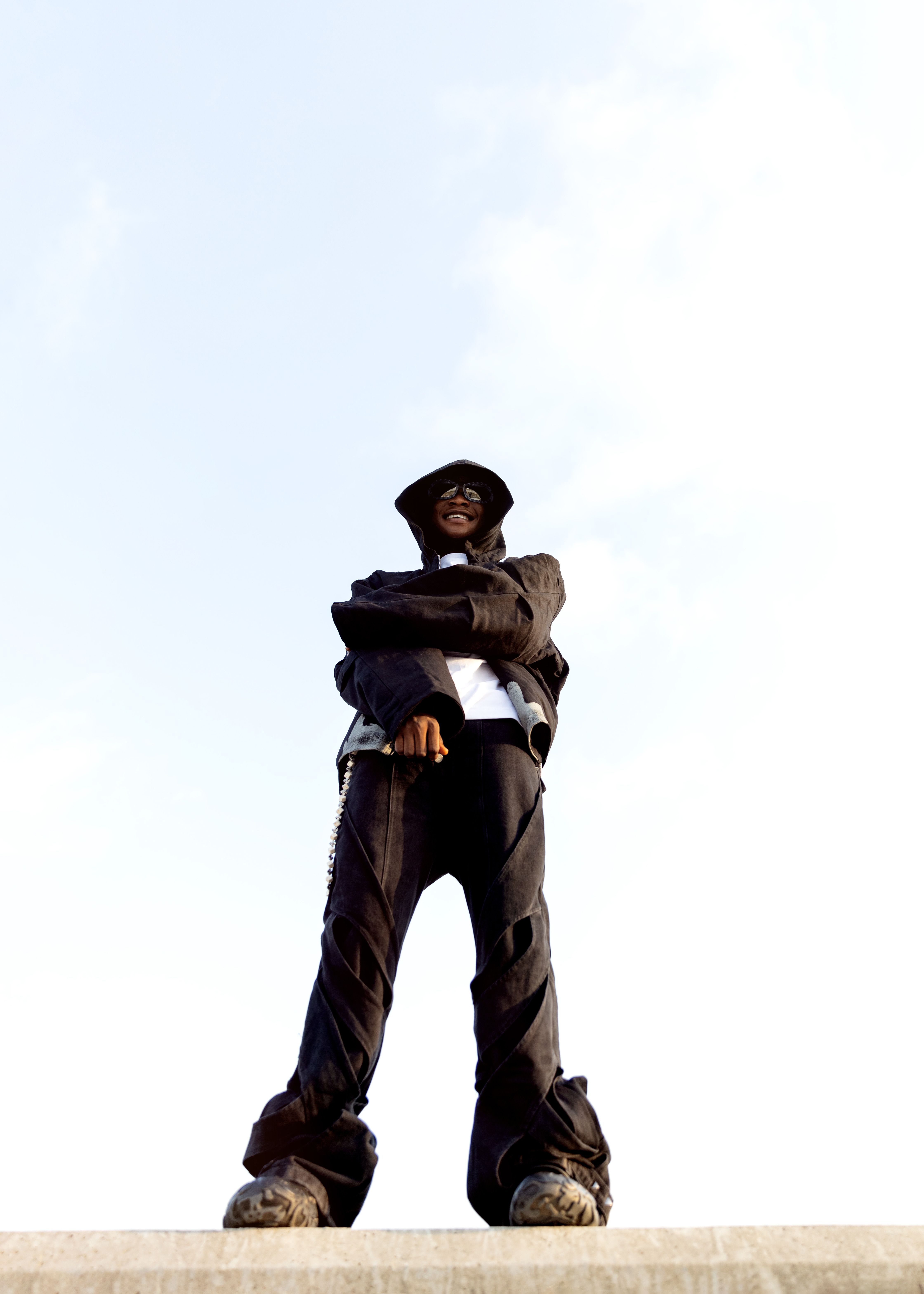 Confident Urban Fashion Man on Rooftop · Free Stock Photo