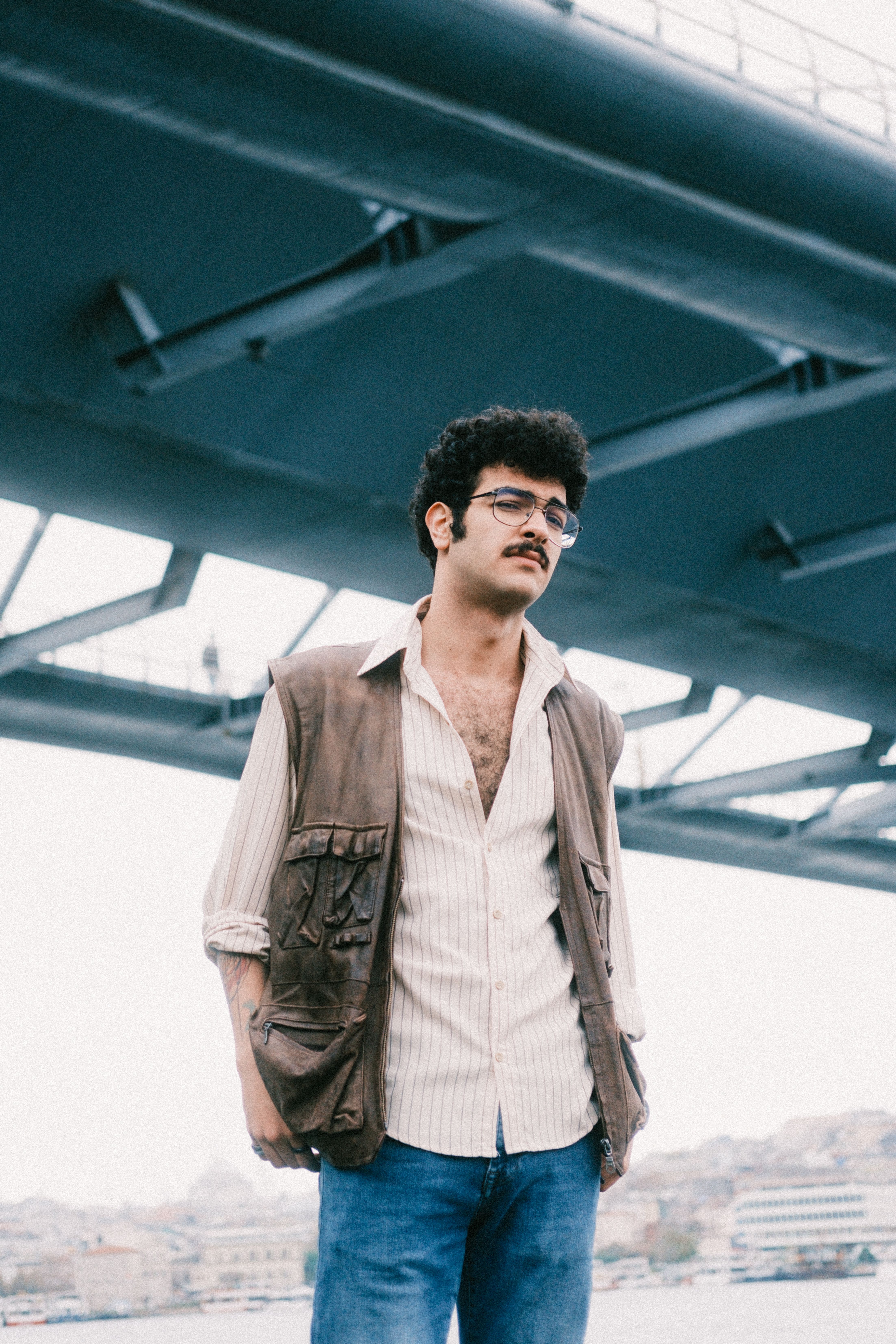 Vintage fashion style under Galata Bridge, Istanbul vibe captured beautifully.