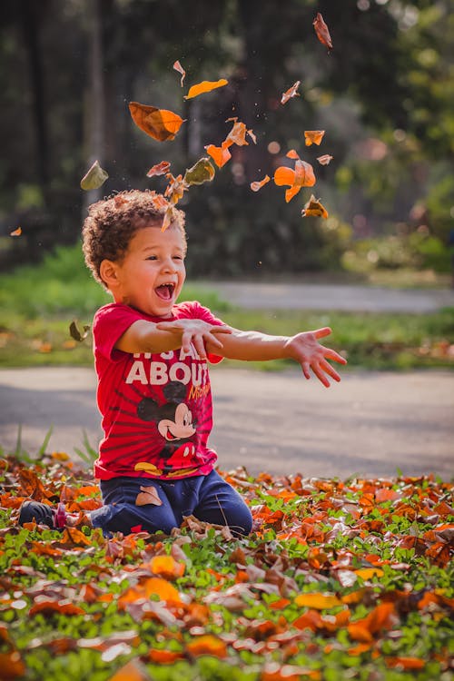 Boy Wearing Red T-shirt and Blue Pants