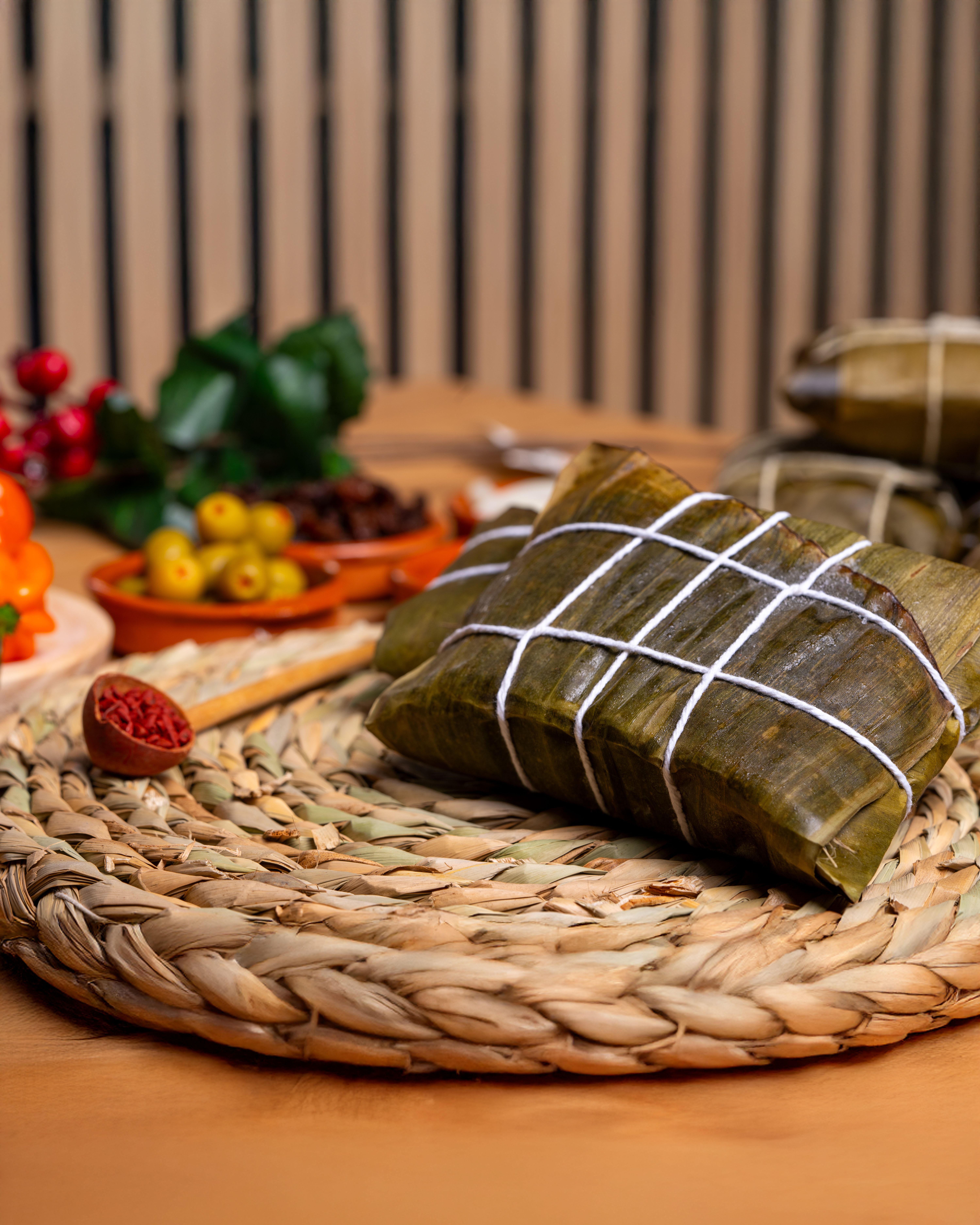 Traditional Leaf-Wrapped Food on Woven Mat · Free Stock Photo