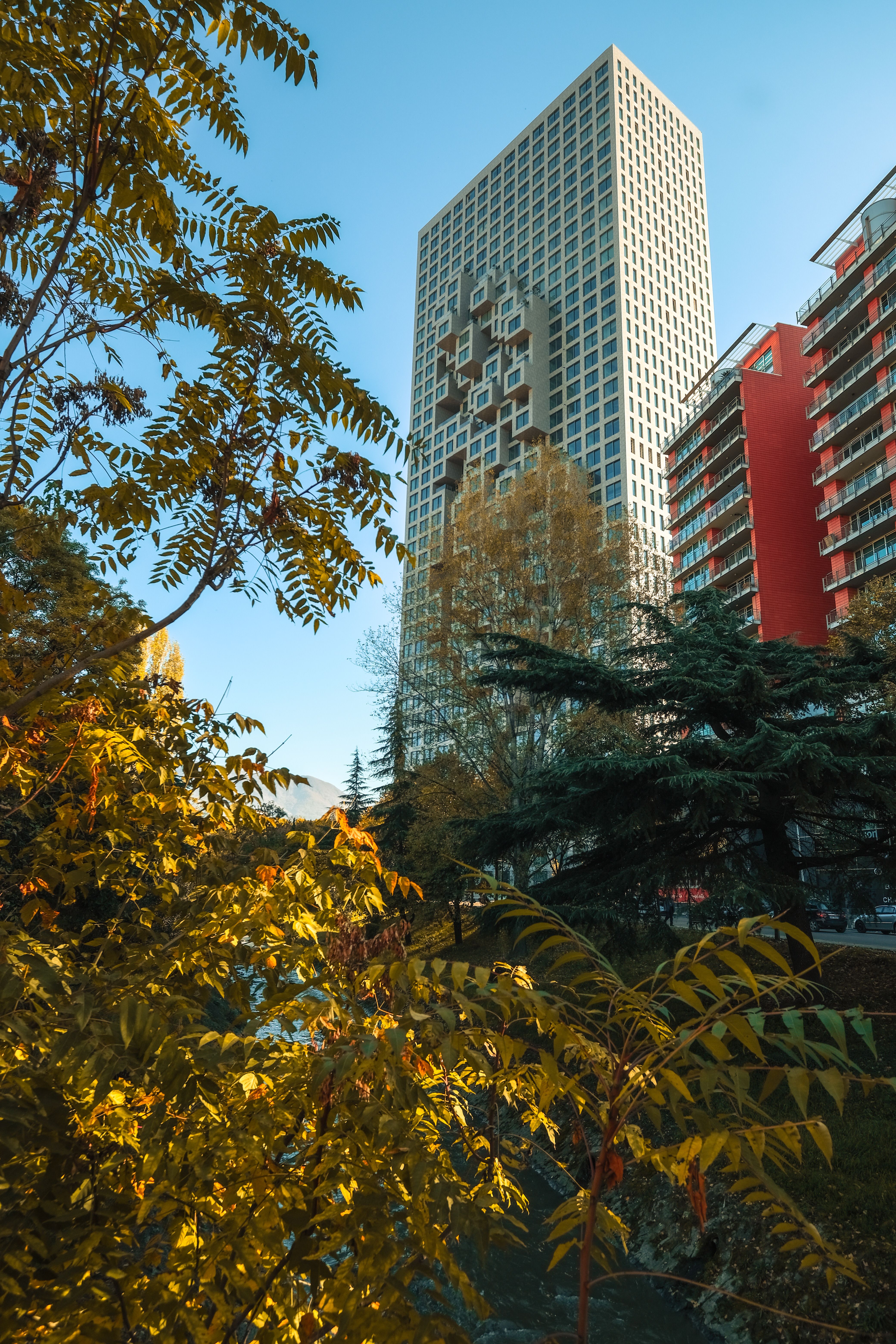 Modern Urban Architecture in Leafy Park Setting · Free Stock Photo