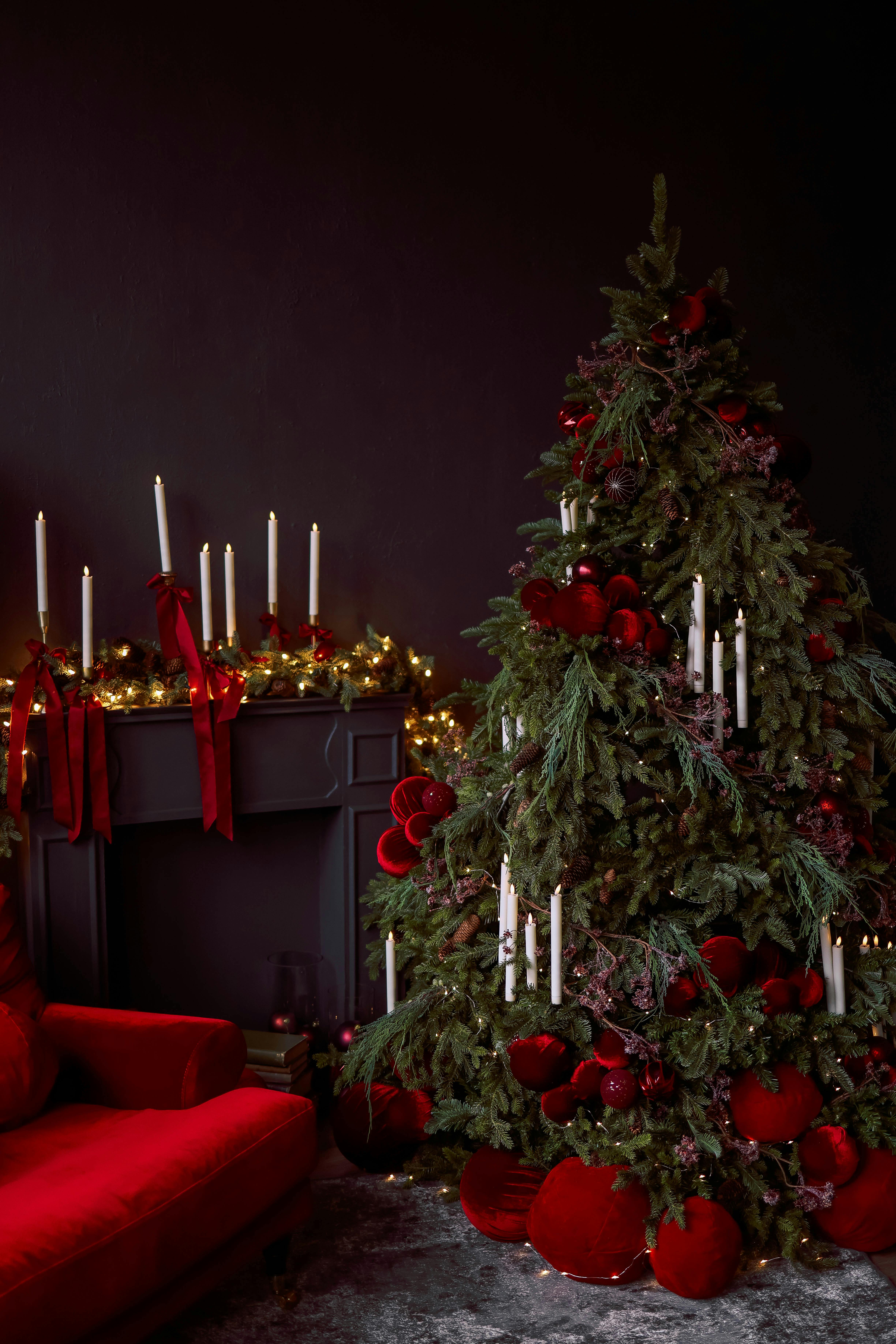 Beautiful Christmas tree and candles create a cozy festive atmosphere.