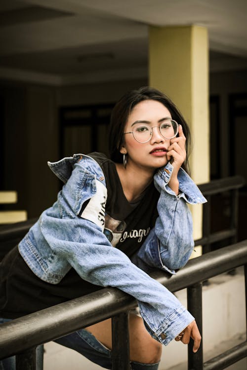 Photo Of Woman Leaning On Handrail