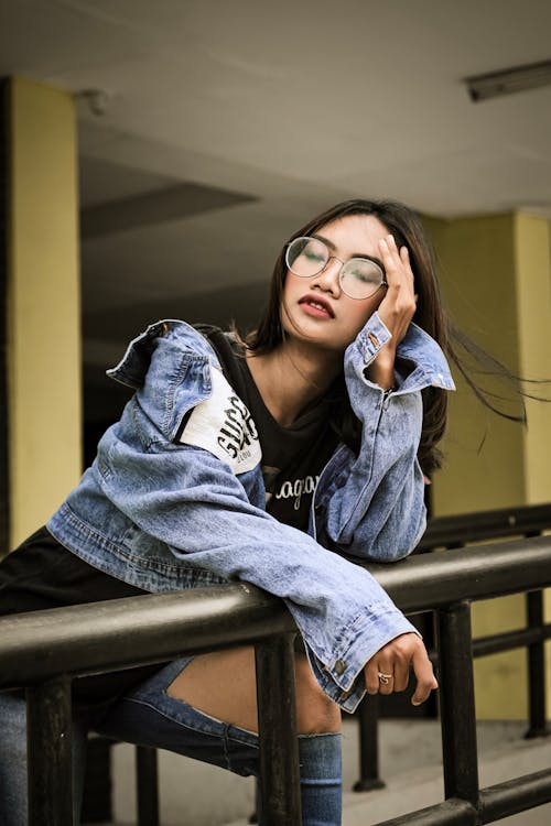 Photo Of Woman Leaning On Handrail