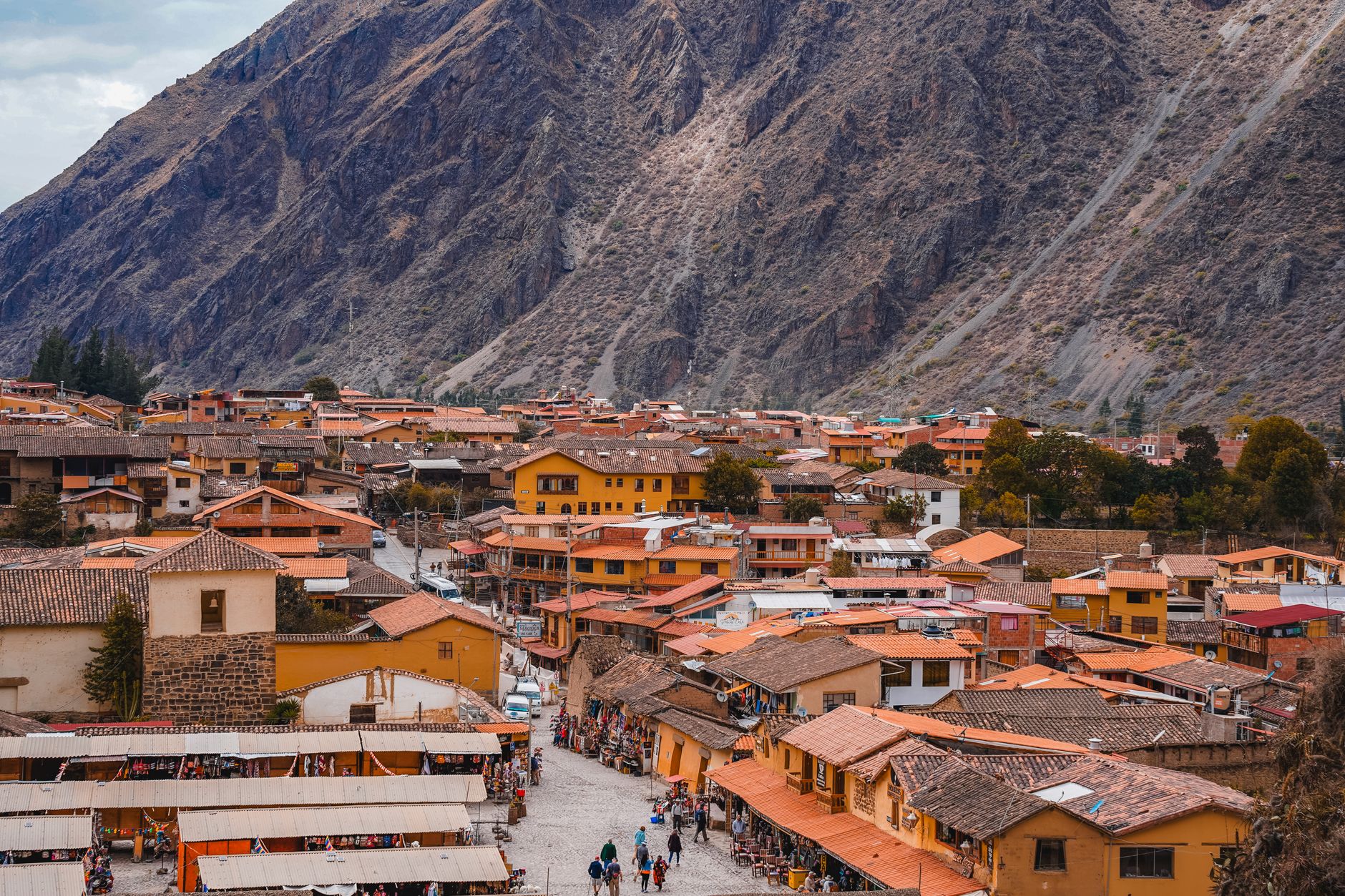 Panoramic view of the historical town Ollantaytambo nestled in the Andes mountains, Cusco, Peru.