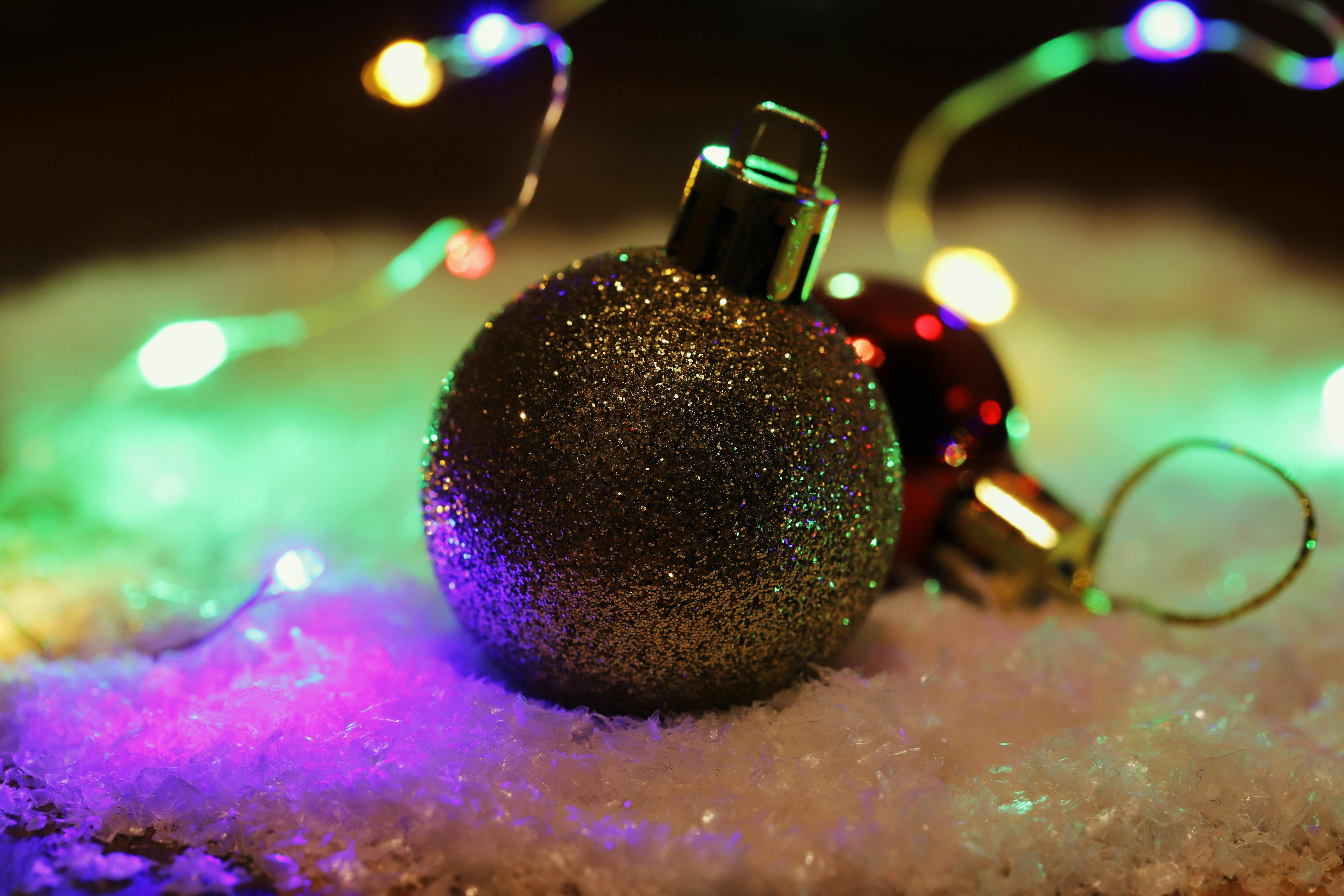 paw print christmas ornaments - Festive Christmas ornaments with sparkling lights and snow for holiday decor.