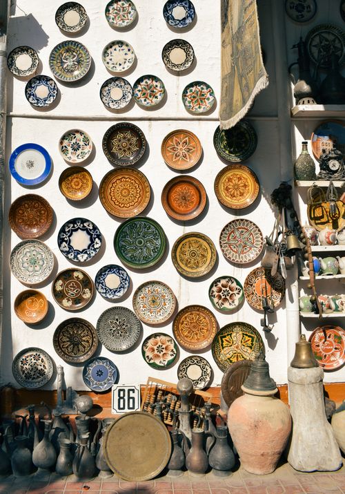 Free A vibrant display of traditional handcrafted pottery and ceramics in Bukhara, Uzbekistan. Stock Photo