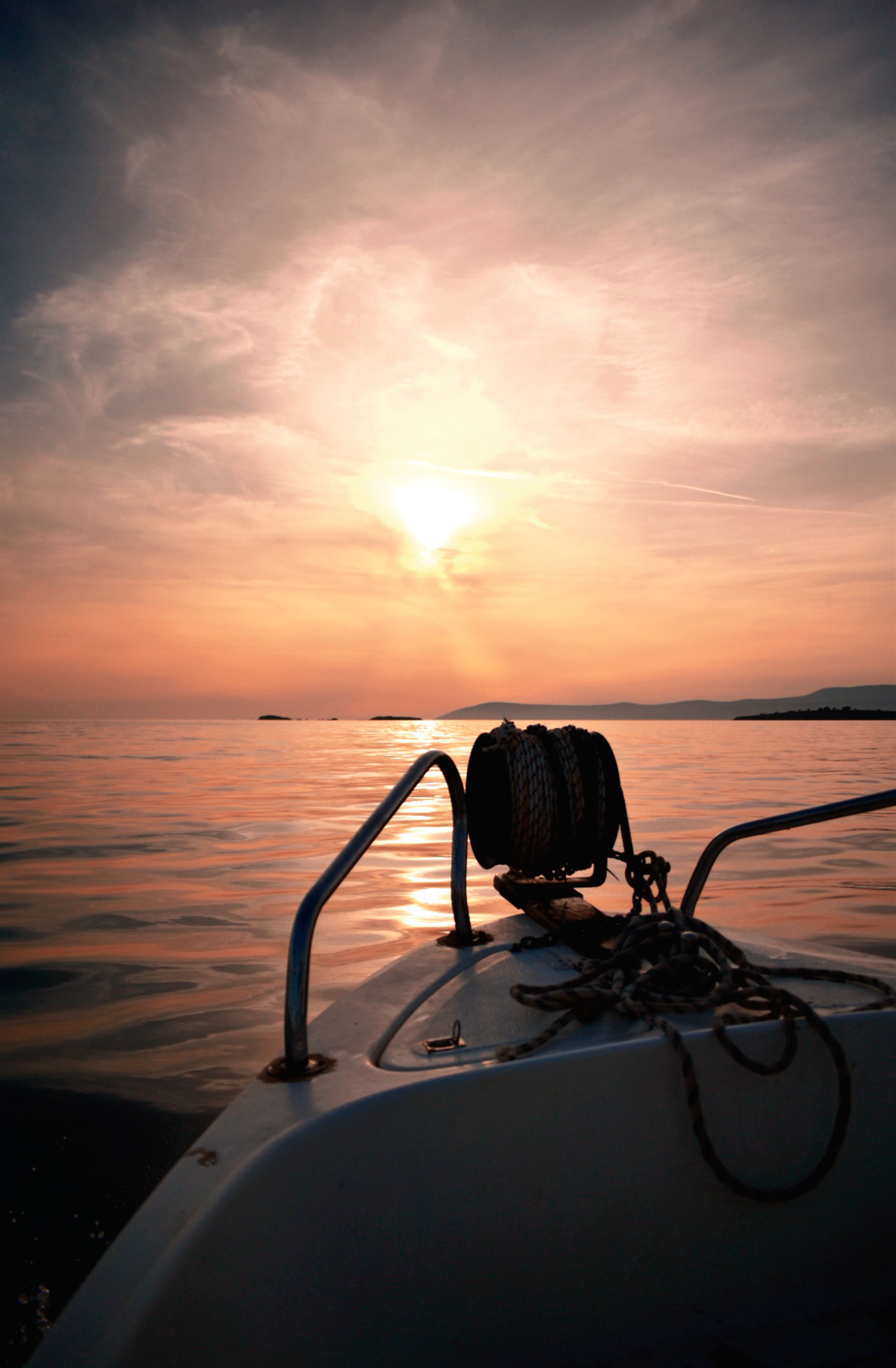 Serene Sunset View from Boat on Calm Sea · Free Stock Photo