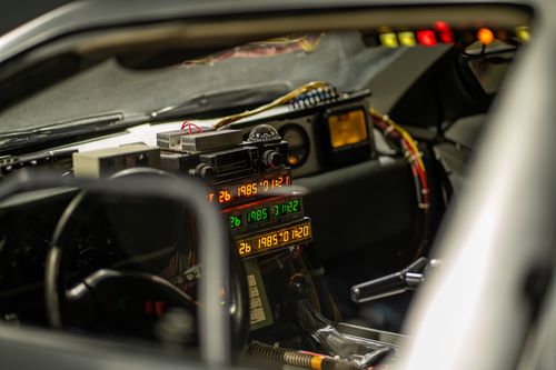 Free Close-up of a vehicle's cockpit showcasing a time-travel display with colorful lights and gadgets. Stock Photo