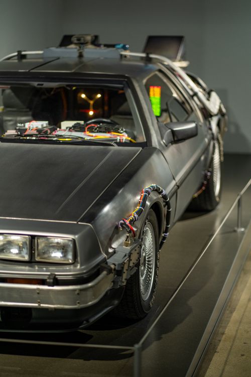 Free Detailed close-up of a futuristic car display with intricate wiring and design indoors. Stock Photo