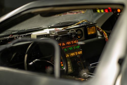 Free Interior of a classic car with retro futuristic gadgets and time travel elements. Stock Photo