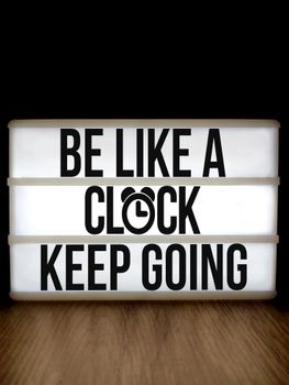 Lightbox displaying 'Be Like a Clock Keep Going' for motivation and inspiration.