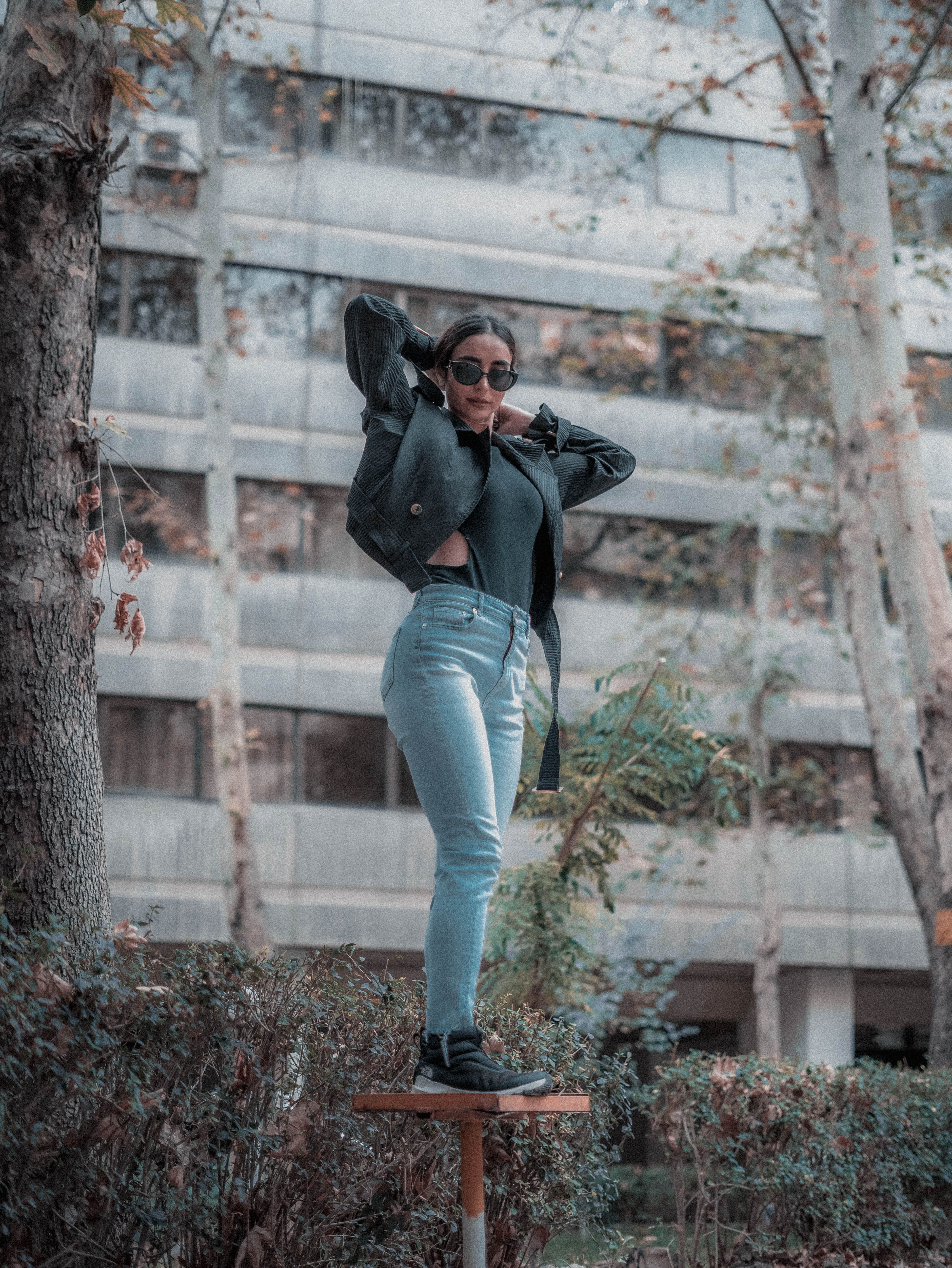 Fashionable Woman Posing Outdoors in Urban Setting · Free Stock Photo