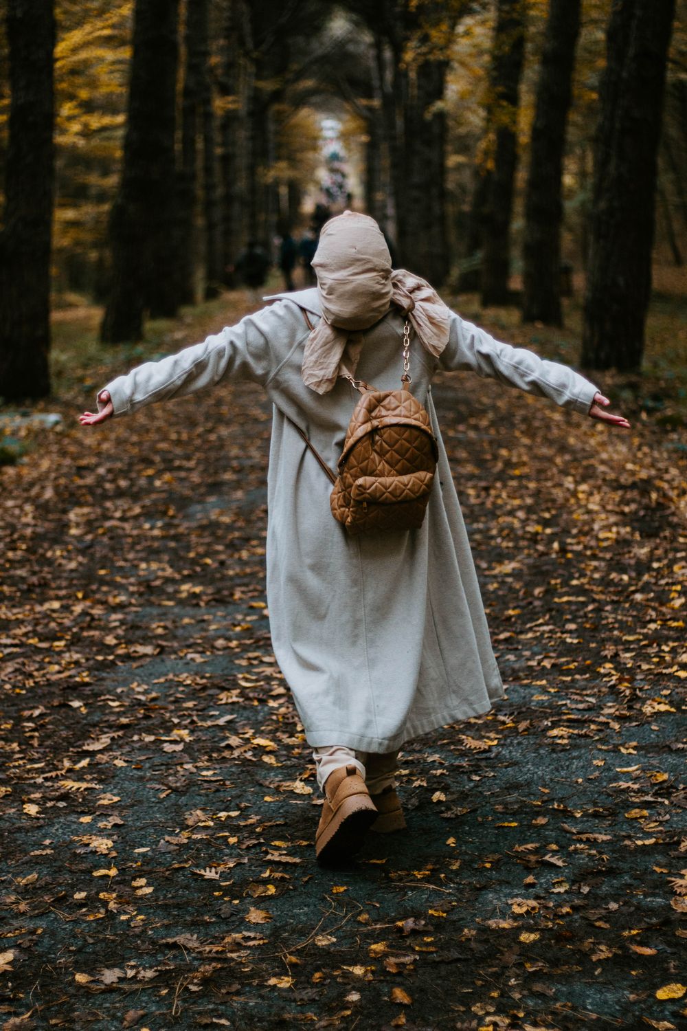 Woman in Autumn Park Walking Enthusiastically · Free Stock Photo