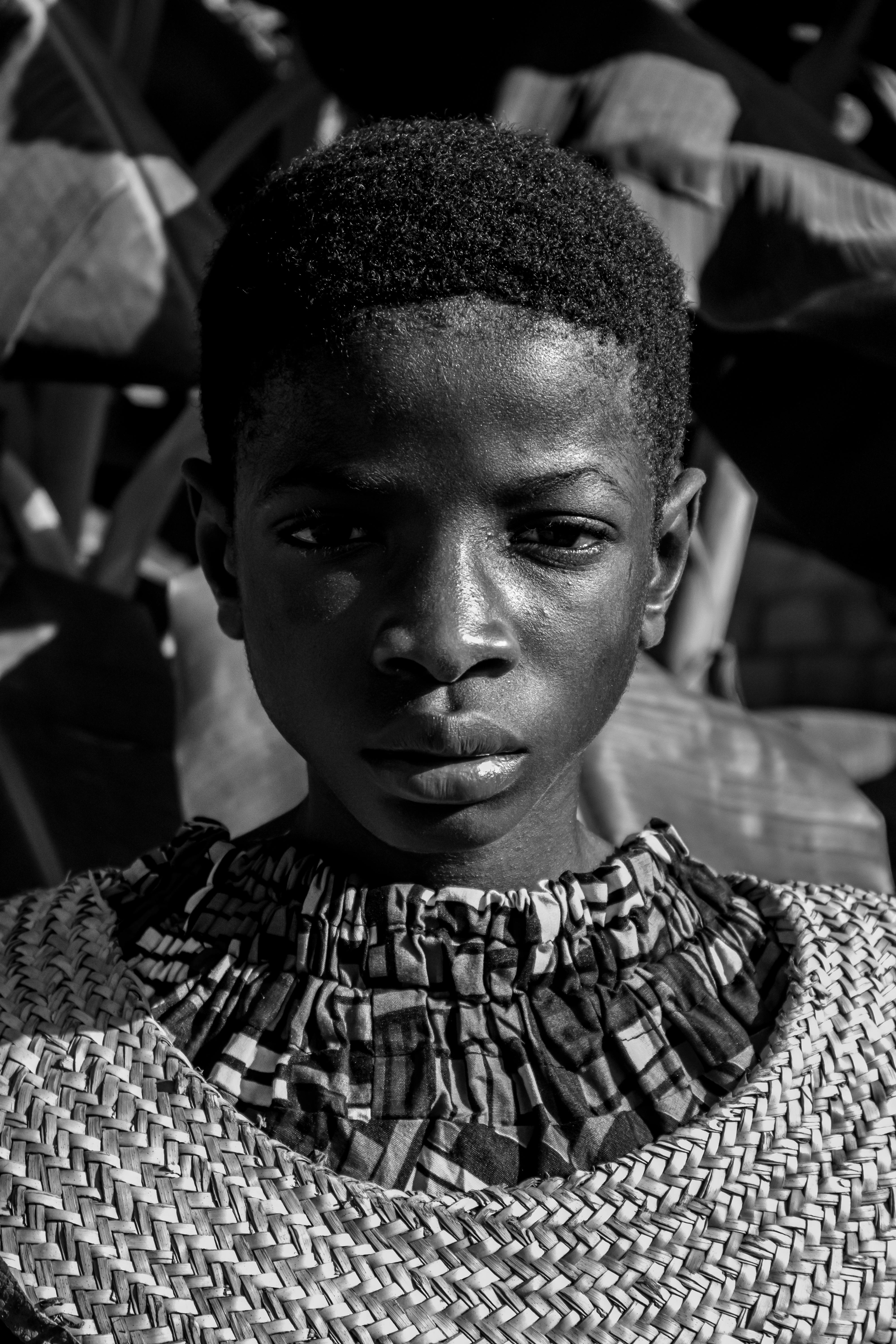 Expressive black and white portrait highlighting youthful intensity and fashion.
