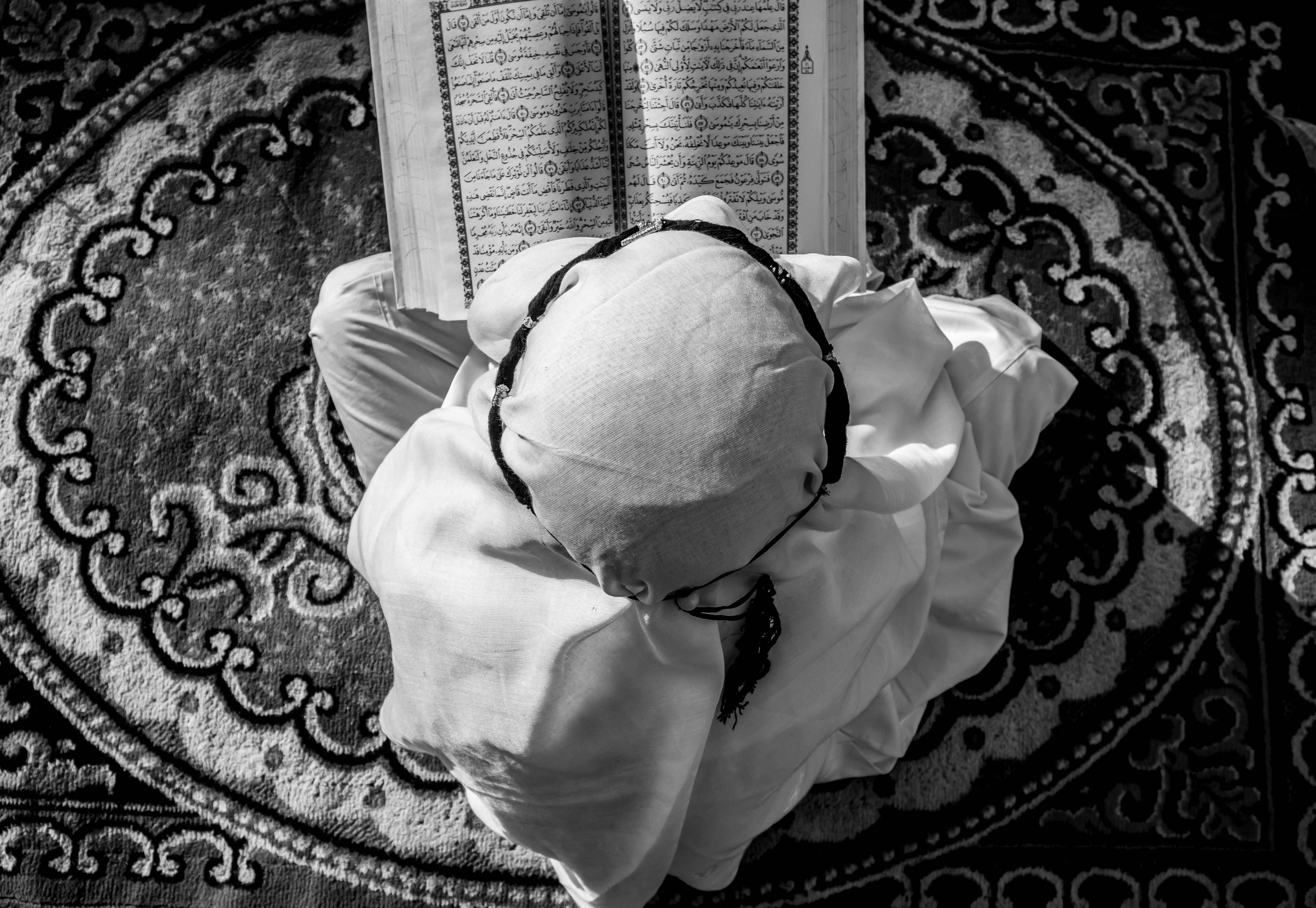 Young learner reading Quran