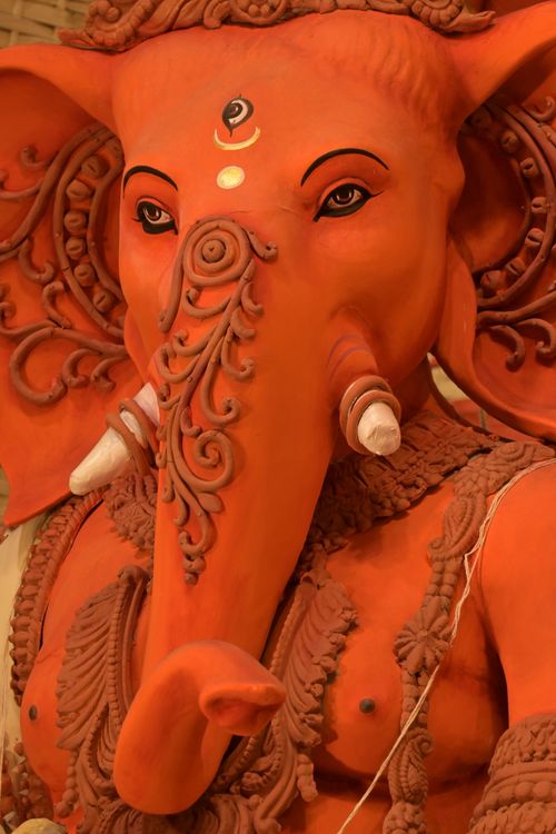Free Close-up of a vibrant Ganesha idol with detailed decorations for Durga Puja in Kolkata. Stock Photo