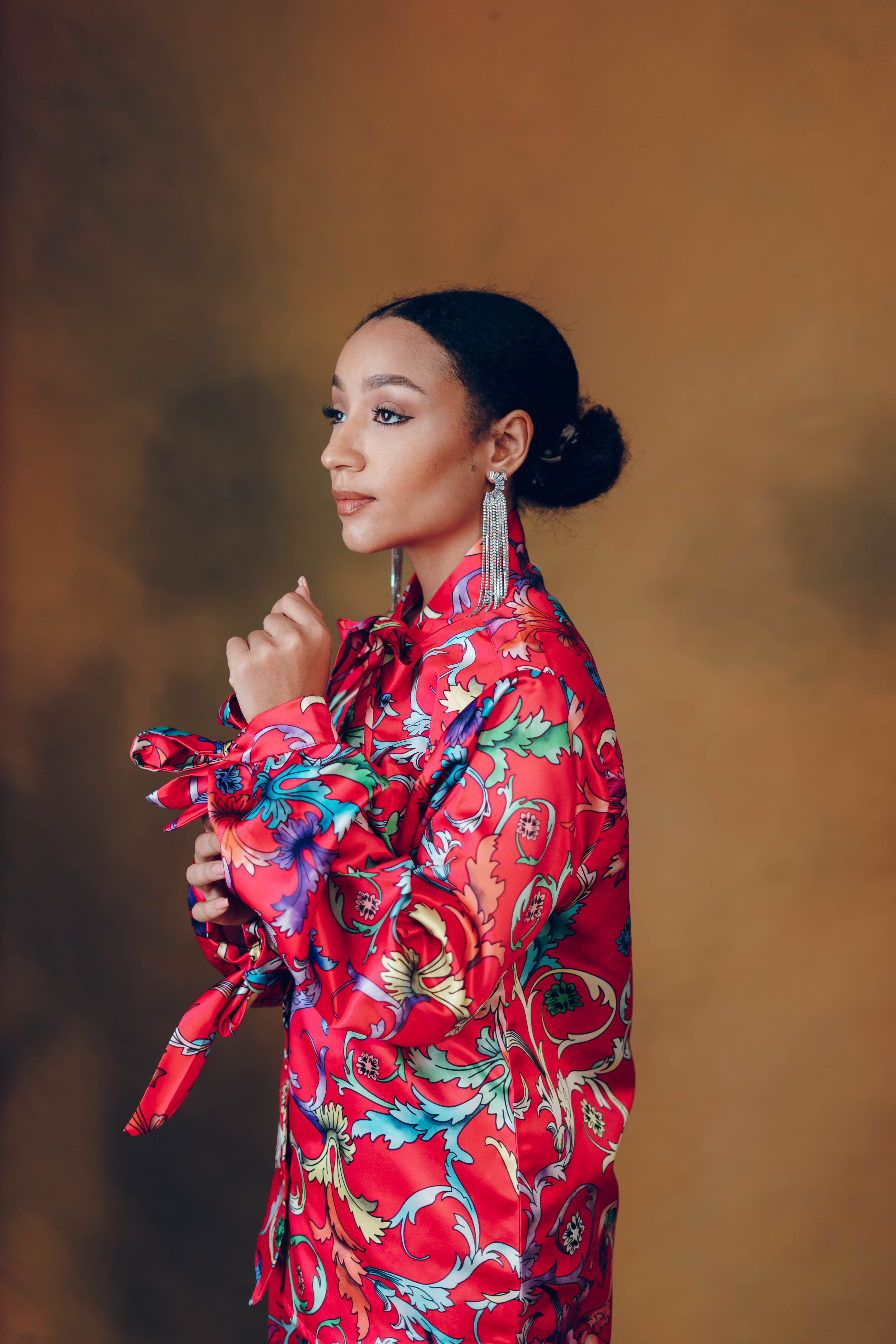A fashion-forward portrait showcasing an elegant woman in colorful attire, embodying grace and style.