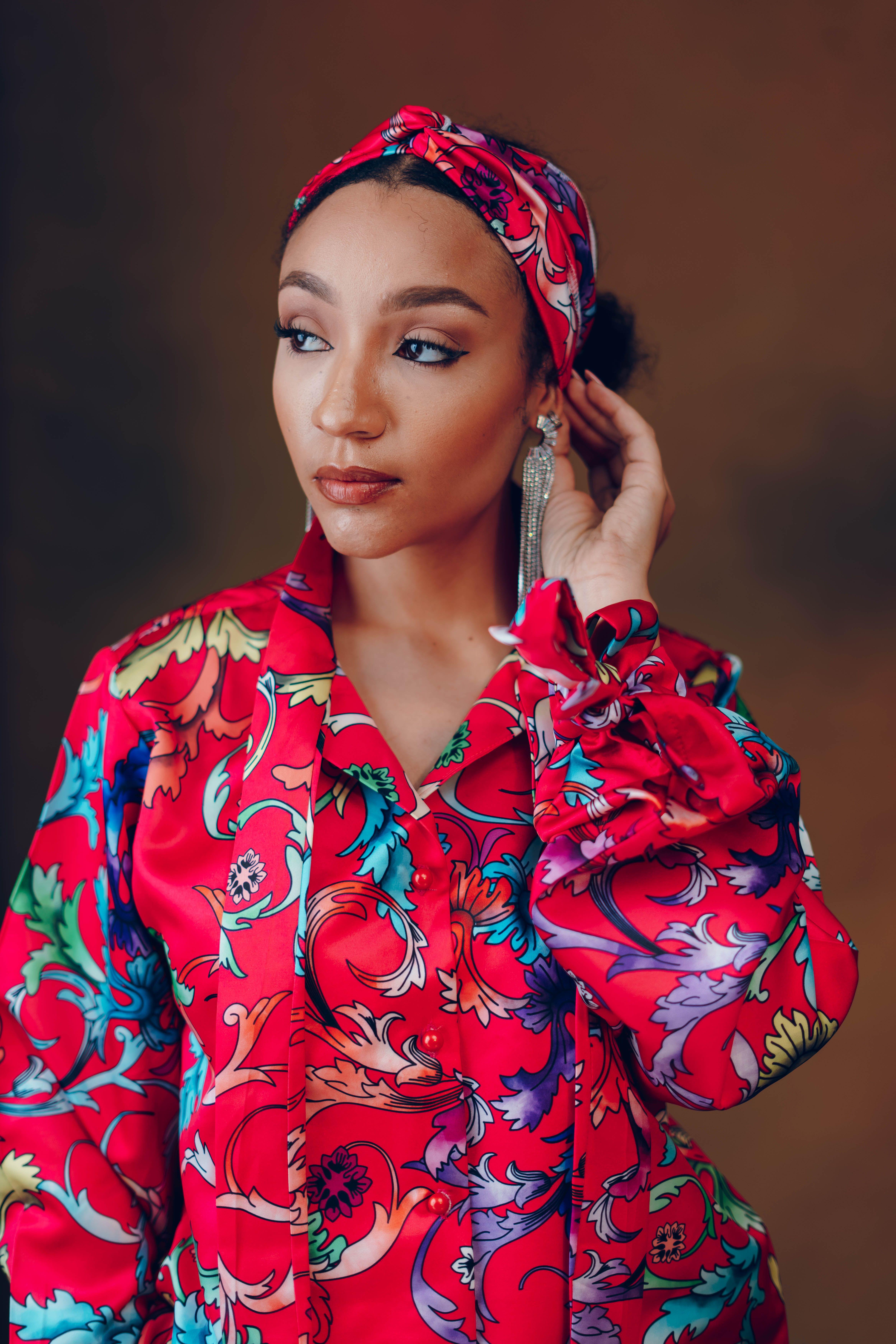 Elegant Woman in Vibrant Floral Dress Portrait · Free Stock Photo
