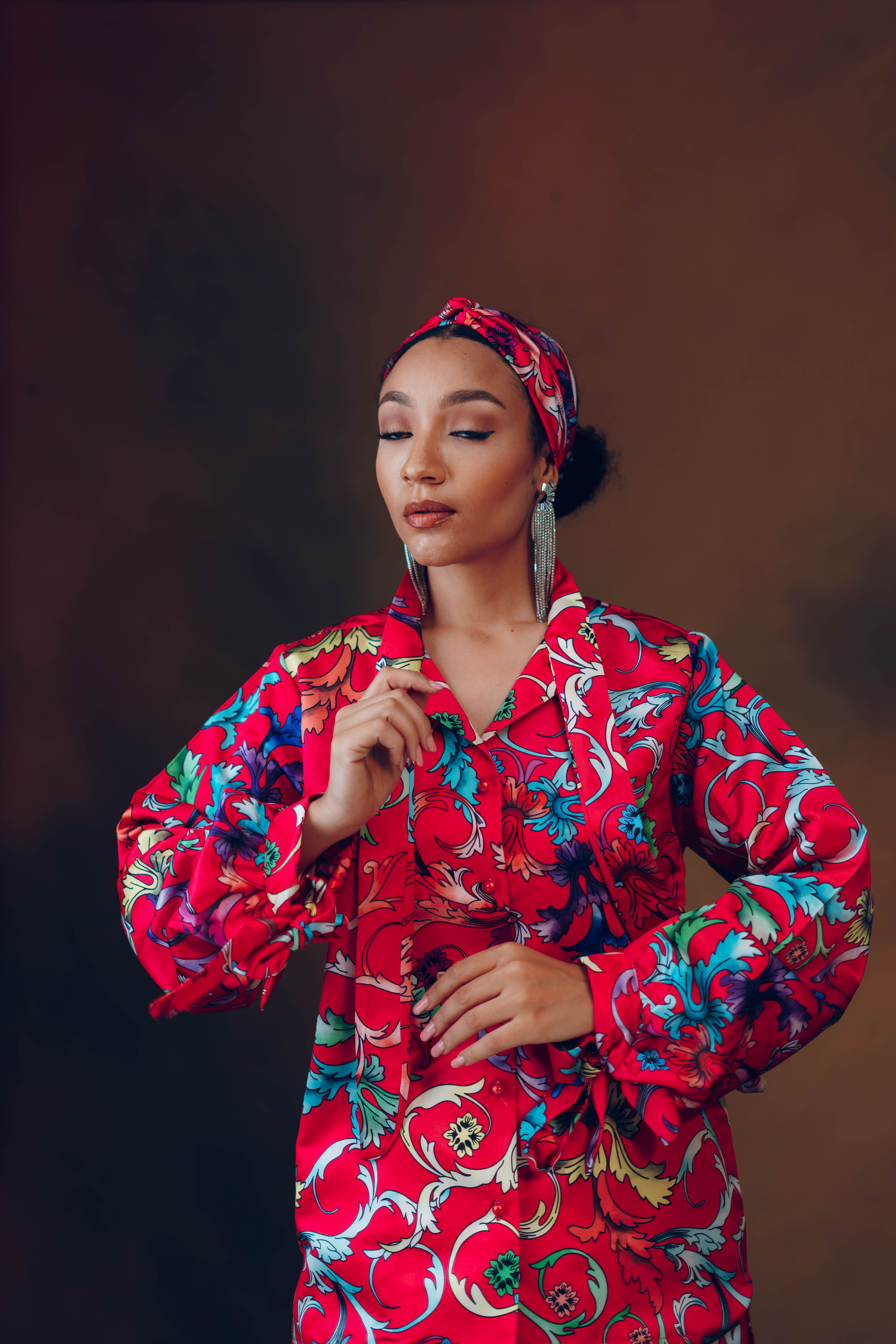 Stylish portrait of a fashionable African model in vibrant traditional attire, showcasing elegance.