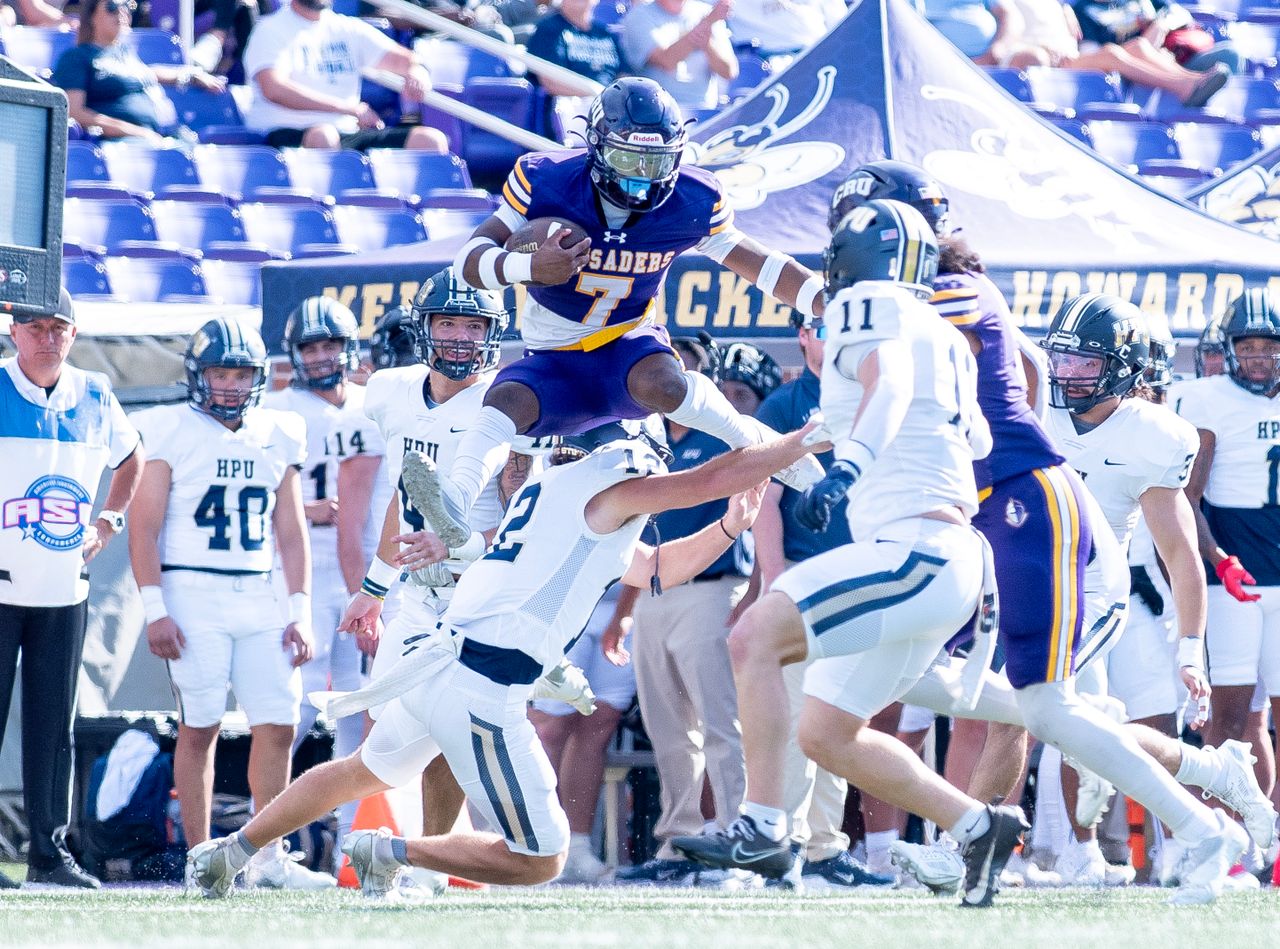 exciting moment in a college football game with players in mid action