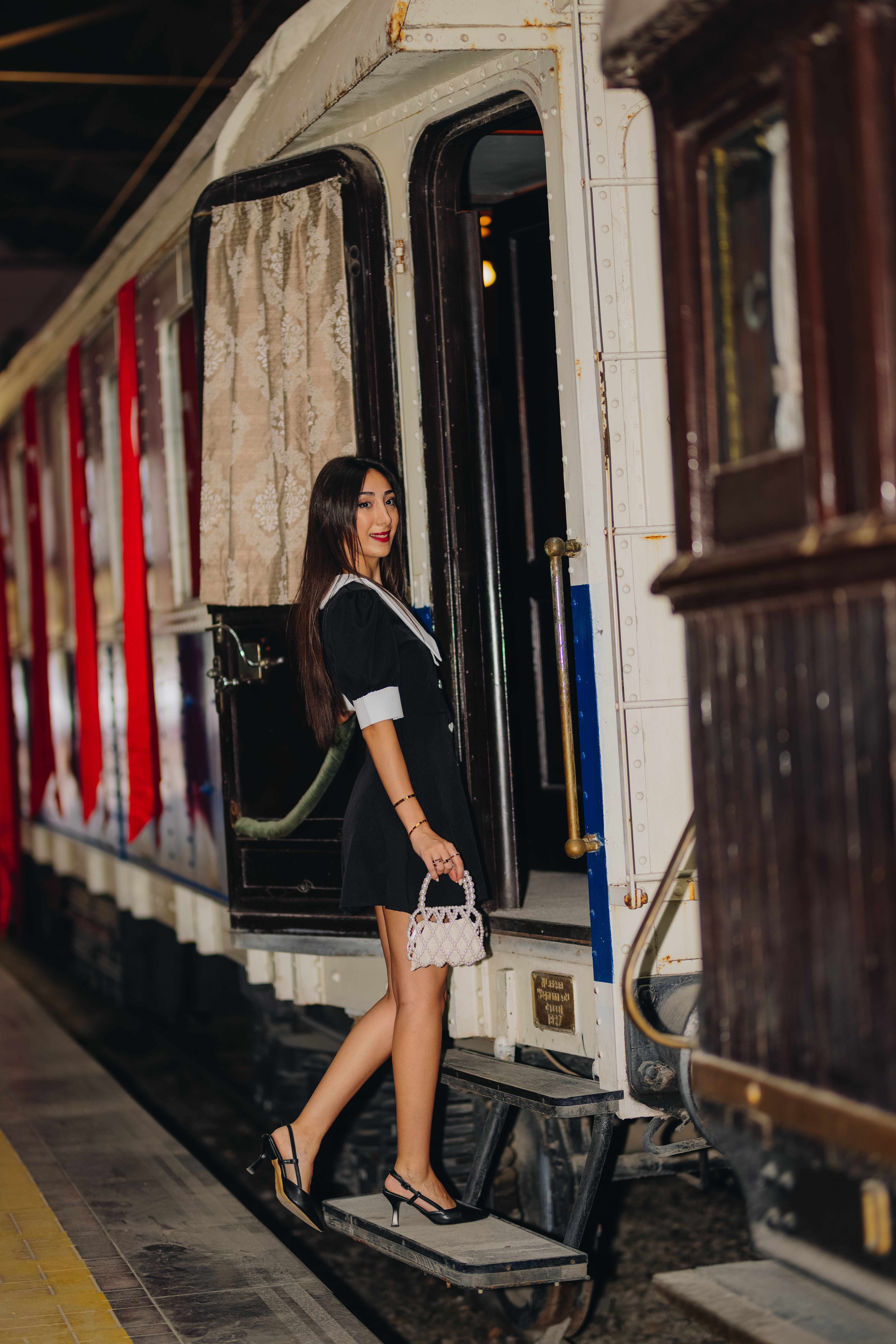 Woman Boarding Vintage Train in Stylish Outfit · Free Stock Photo