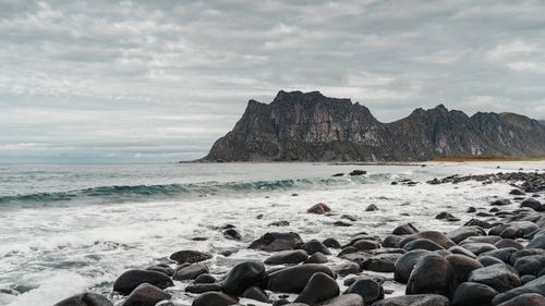 Free Explore the rugged beauty of Lofoten Islands with this stunning rocky beach view. Stock Photo