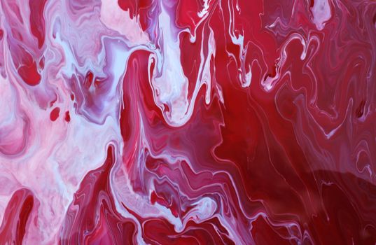 Vibrant abstract artwork with swirling red and white fluid patterns.