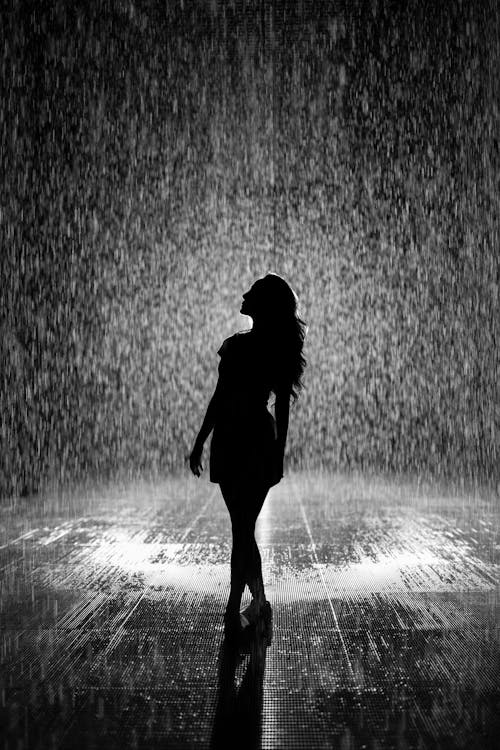 Free Silhouette Of Woman Under Rain Stock Photo