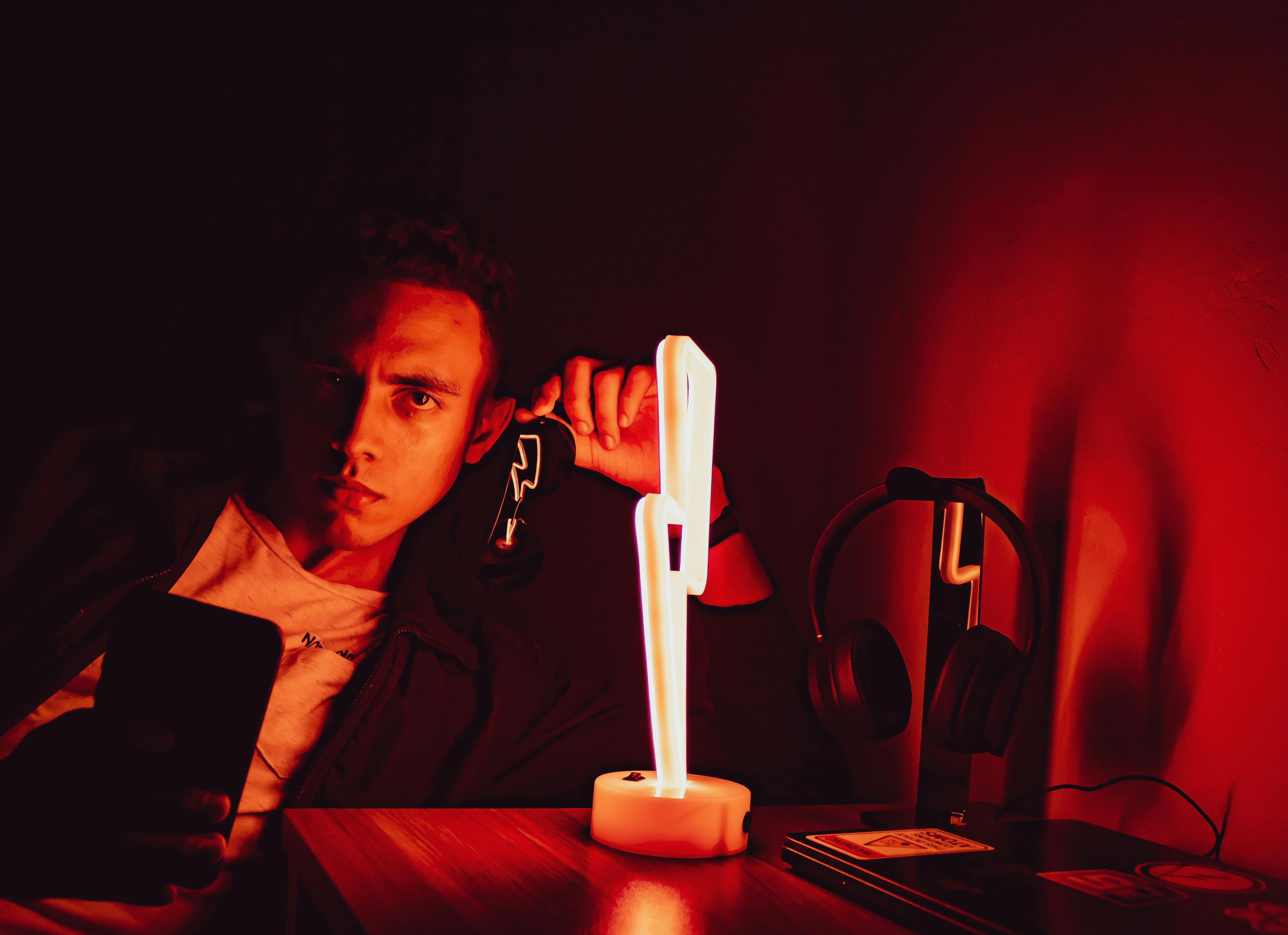 A Man beside a LED Lamp · Free Stock Photo