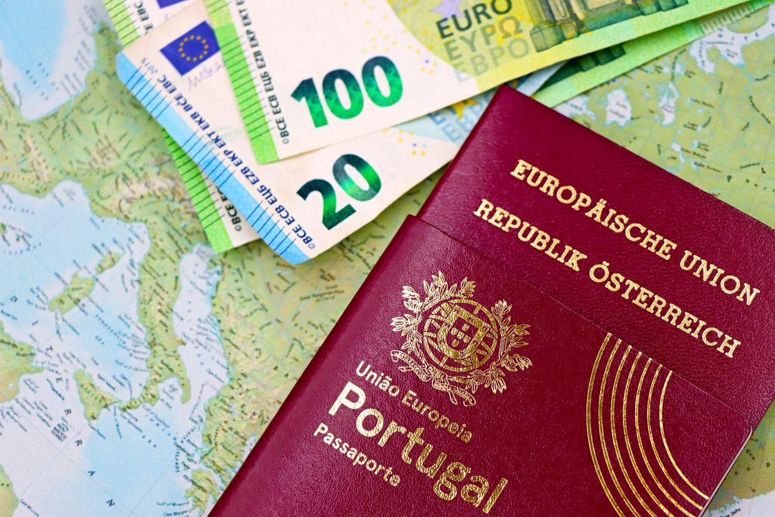 European passports with euro currency on map showing immigration travel costs