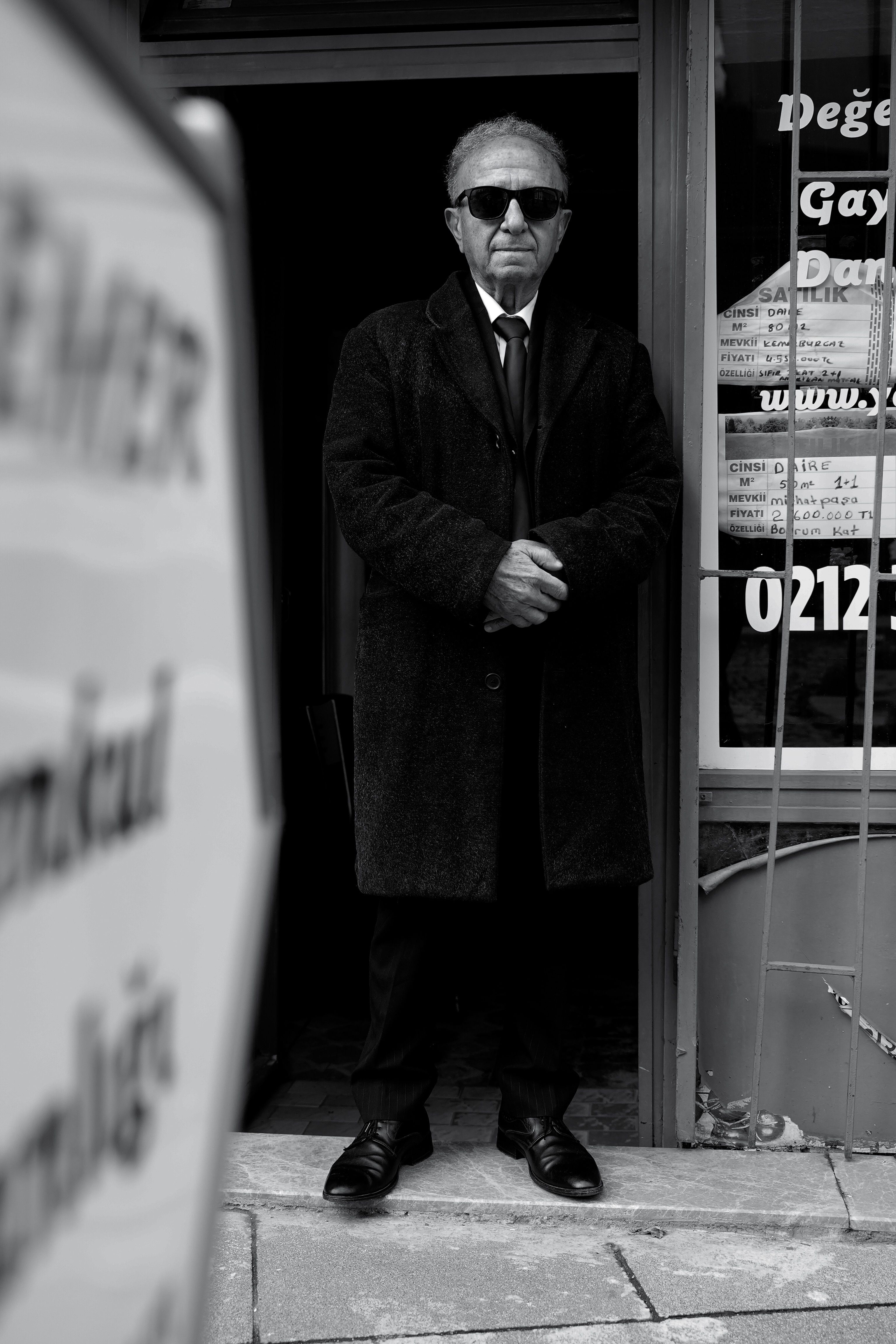 Sophisticated older gentleman in black and white street scene, İstanbul.