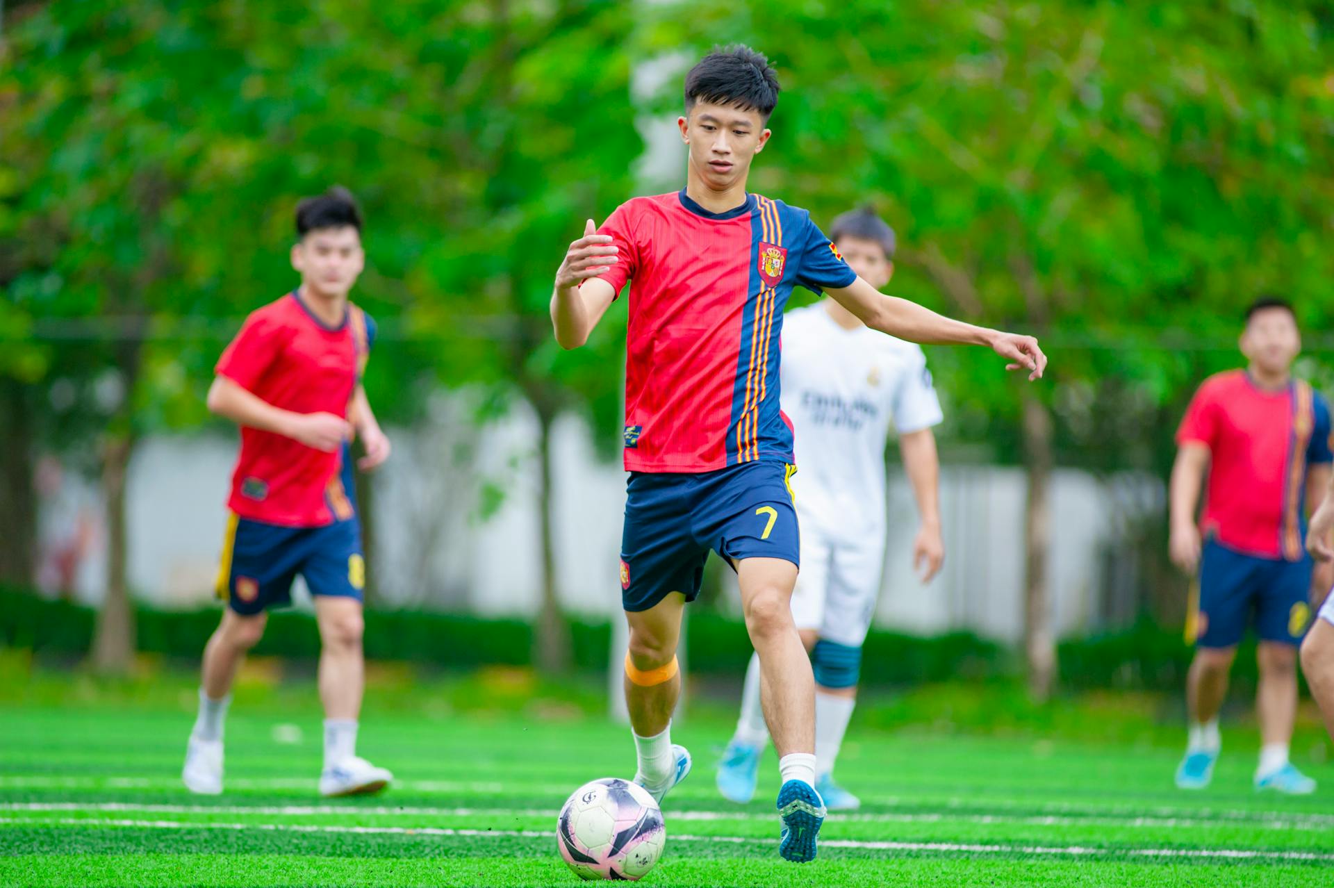 Young soccer players in action during a match in Hà Nội, Vietnam.